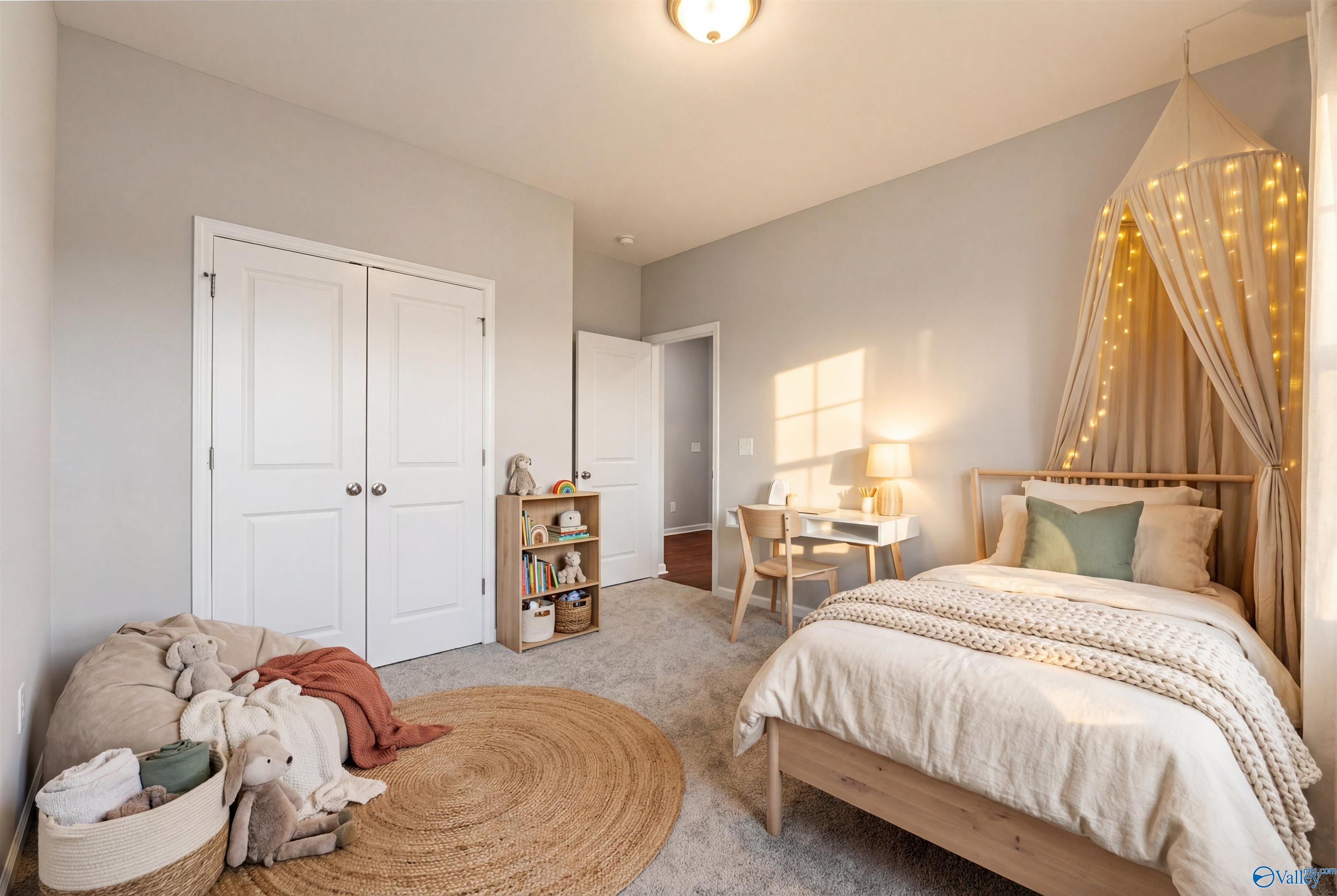 Charming kids' bedroom with canopy bed, fairy lights, stuffed toys, desk in Davidson Homes The Sanctuary, Riverton Preserve, Huntsville