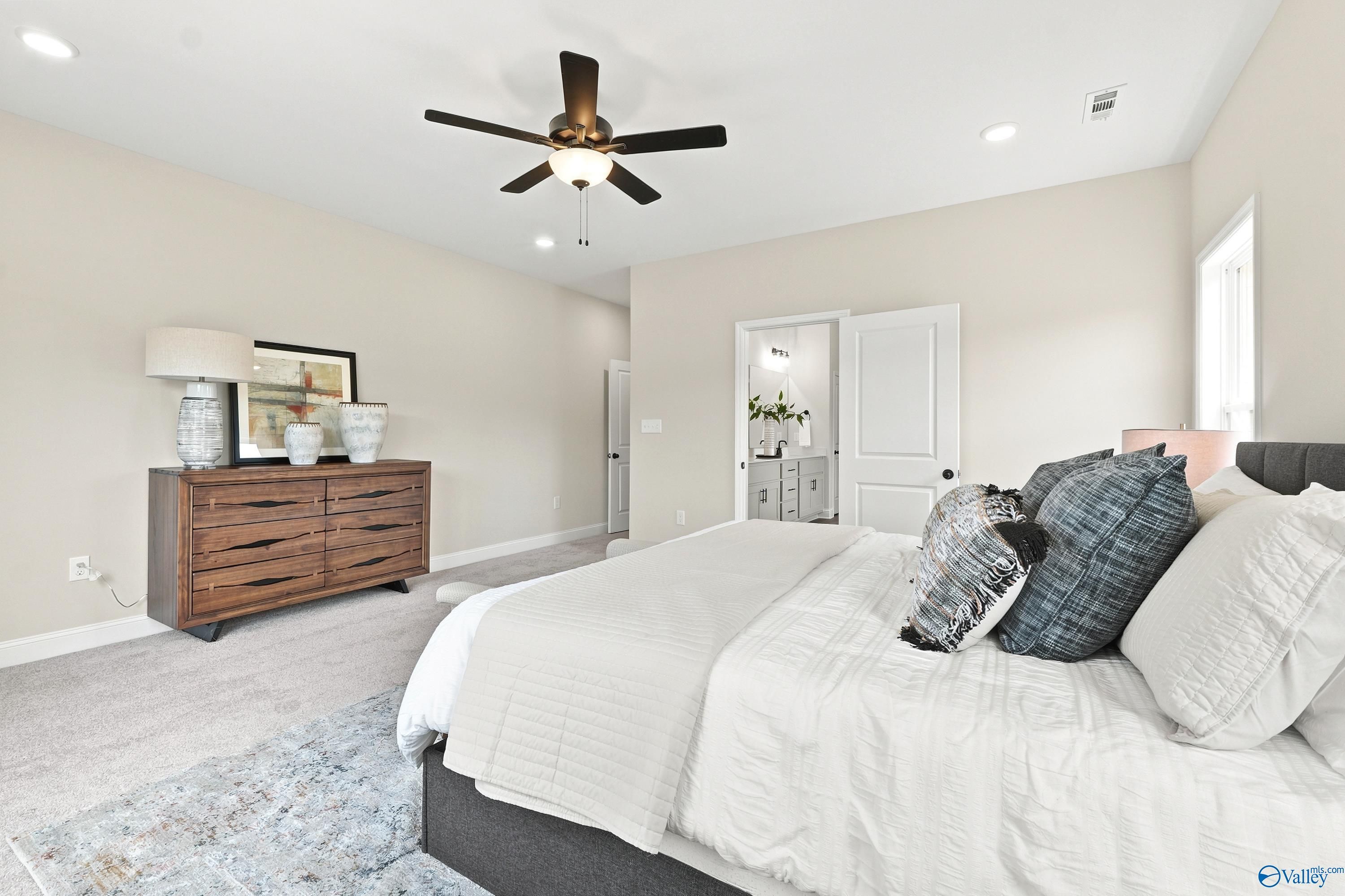 Spacious primary bedroom with en-suite bath in The Finleigh floor plan by Davidson Homes in Riverton Preserve, Huntsville.