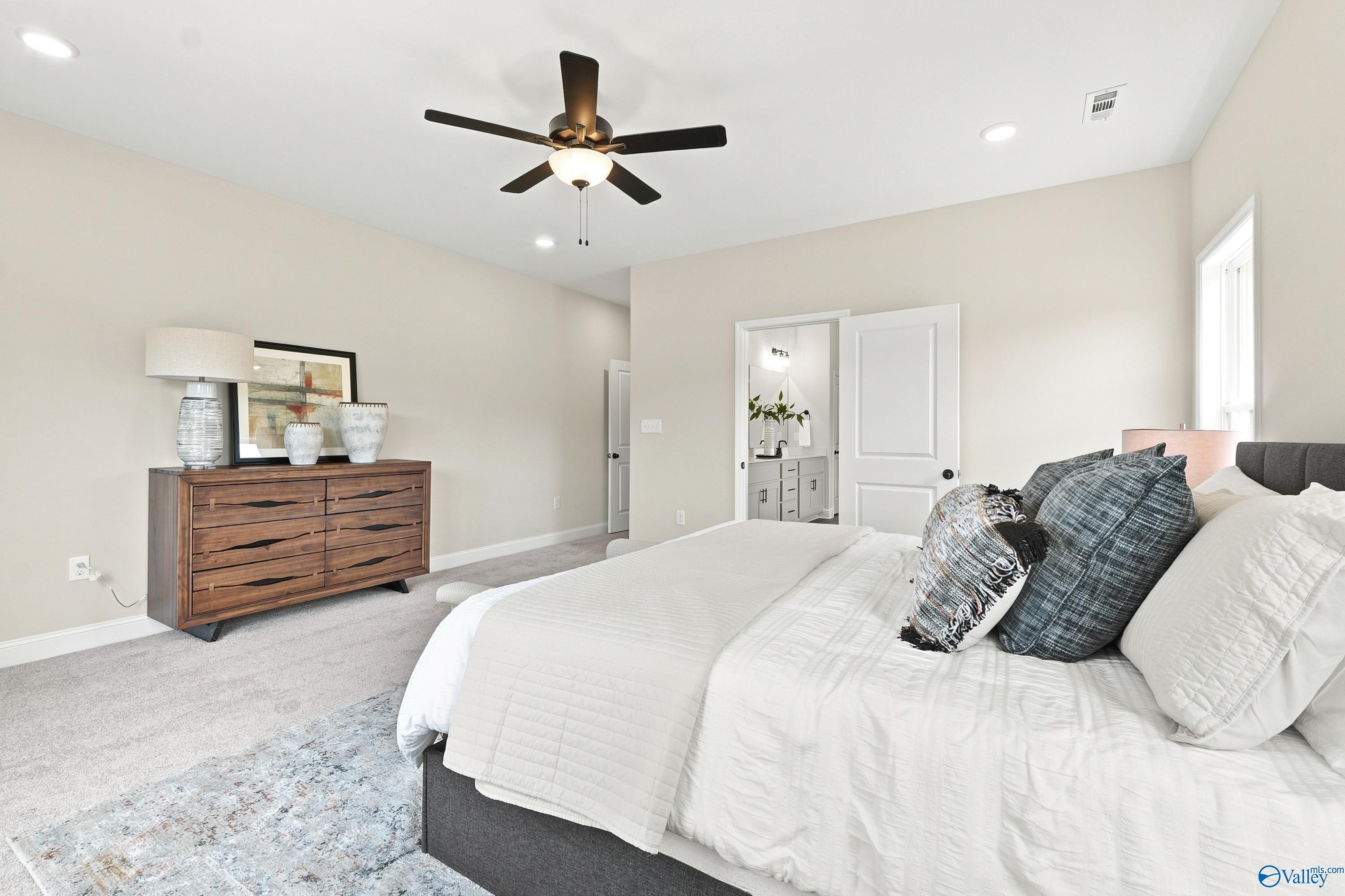 Spacious primary bedroom with en-suite bath in The Finleigh floor plan by Davidson Homes in Riverton Preserve, Huntsville.