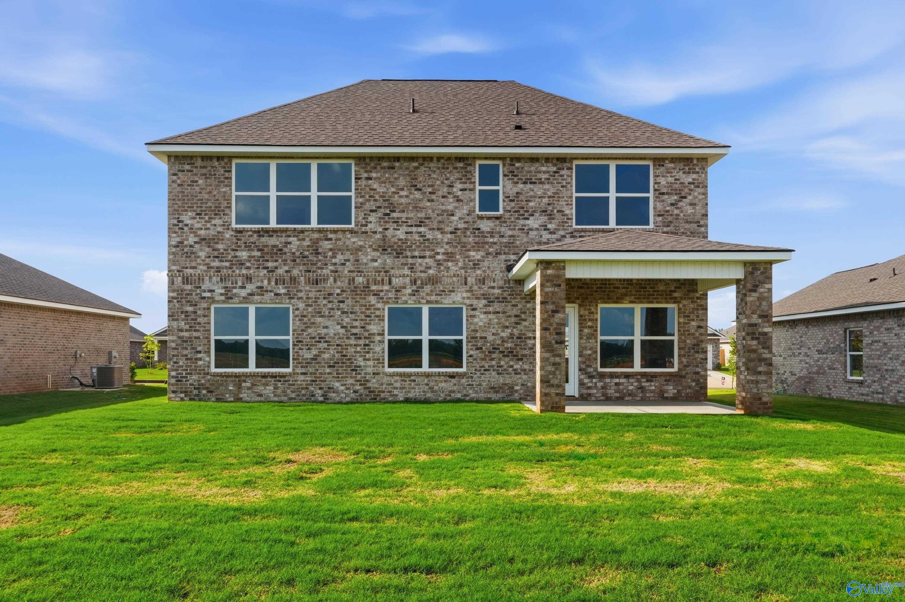 Rear exterior view of The Shelby A floor plan by Davidson Homes in Clearview, Hazel Green, Alabama featuring a back patio.