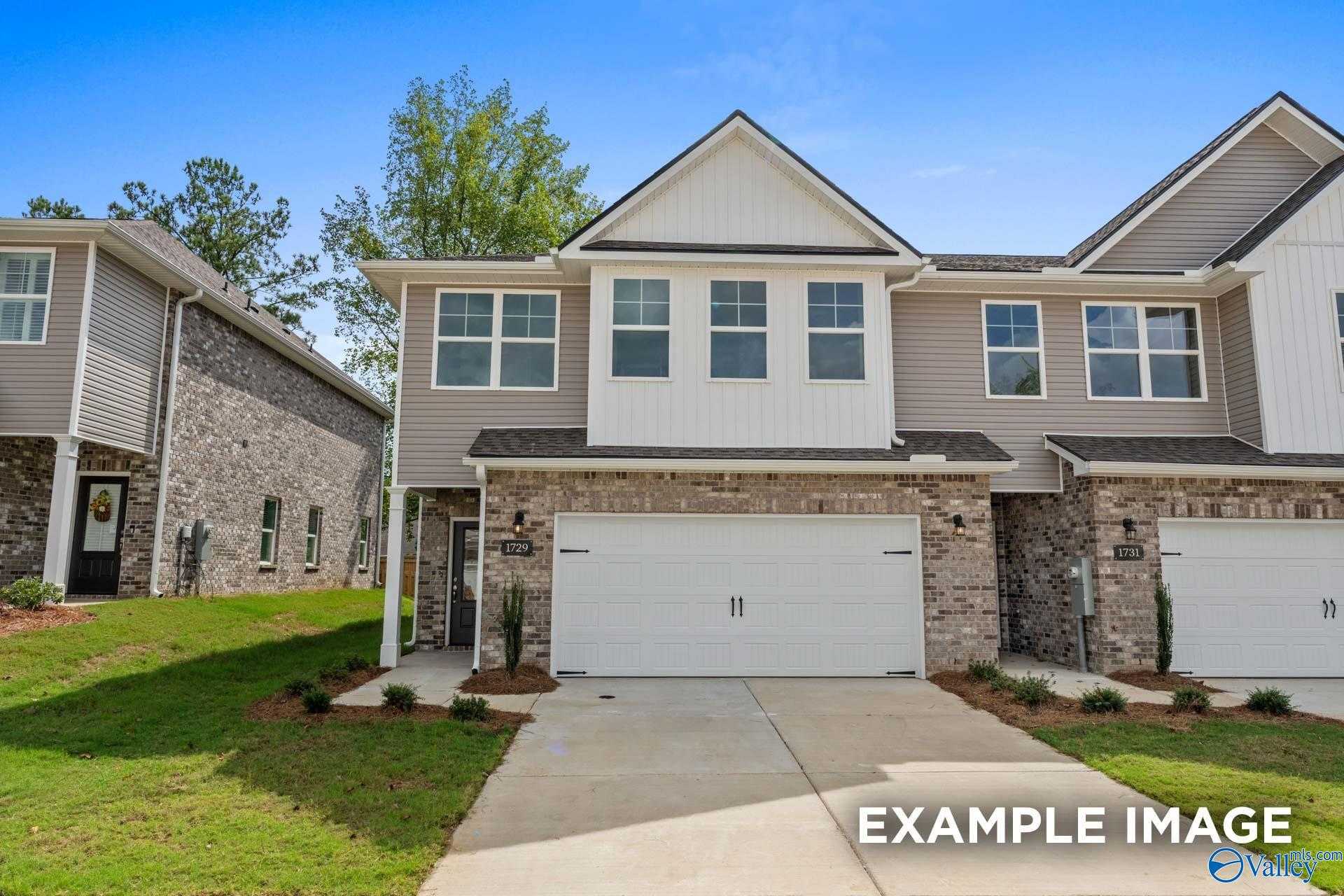 Modern 2-story Camden floor plan home by Davidson Homes in Pavilion, Huntsville, AL, with 2-car garage, brick accents, and driveway