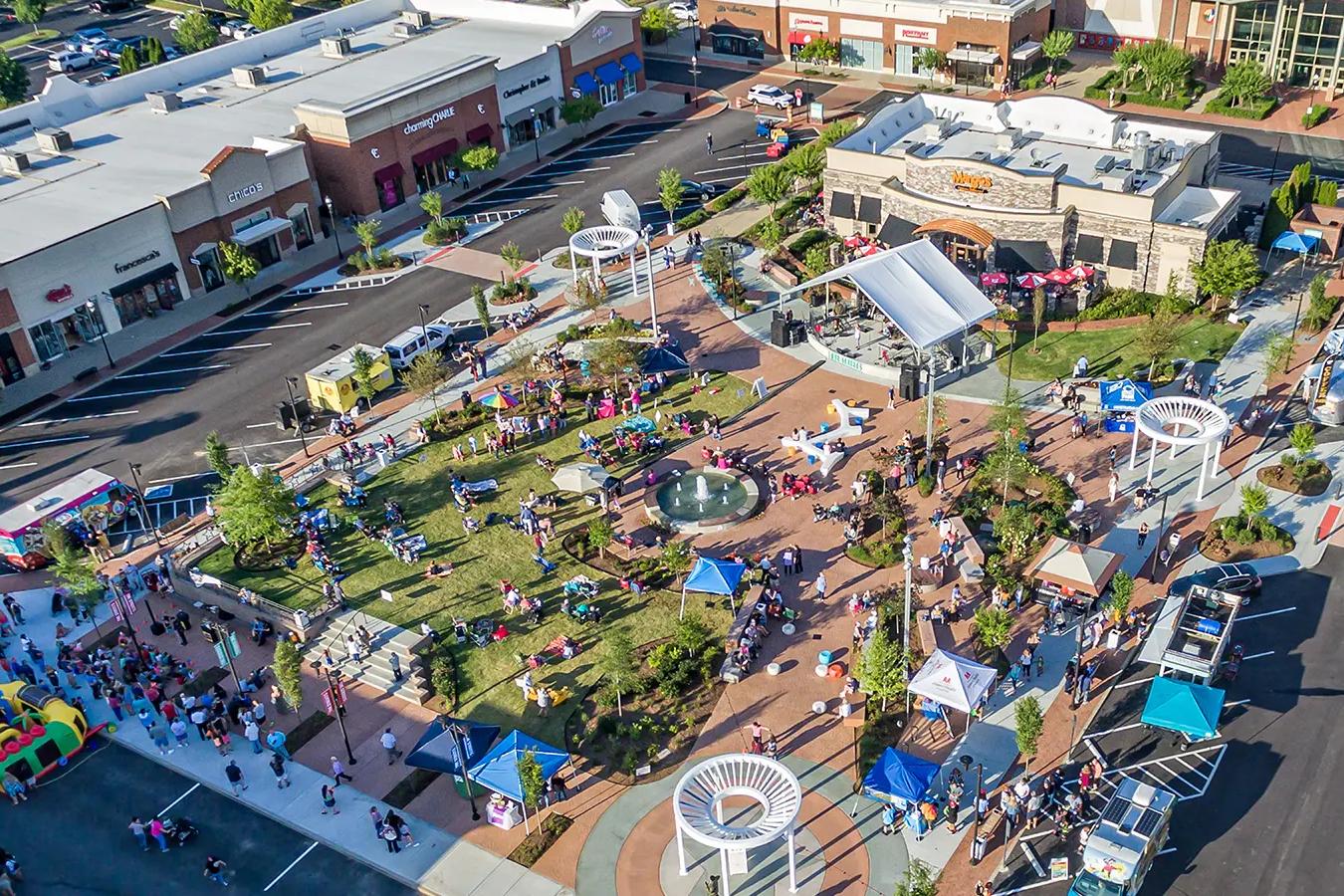 Aerial view of community event at Jackson Village in Hendersonville, Tennessee with live music and outdoor gathering space.