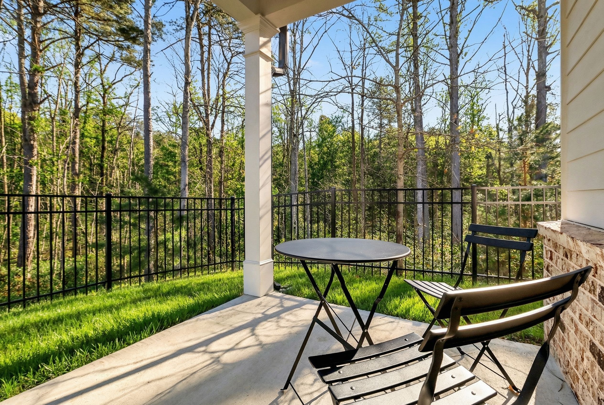 Private covered back patio overlooking private peaceful backyard with fully fenced yard in Davidson Homes The Daphne B, Loganville, GA