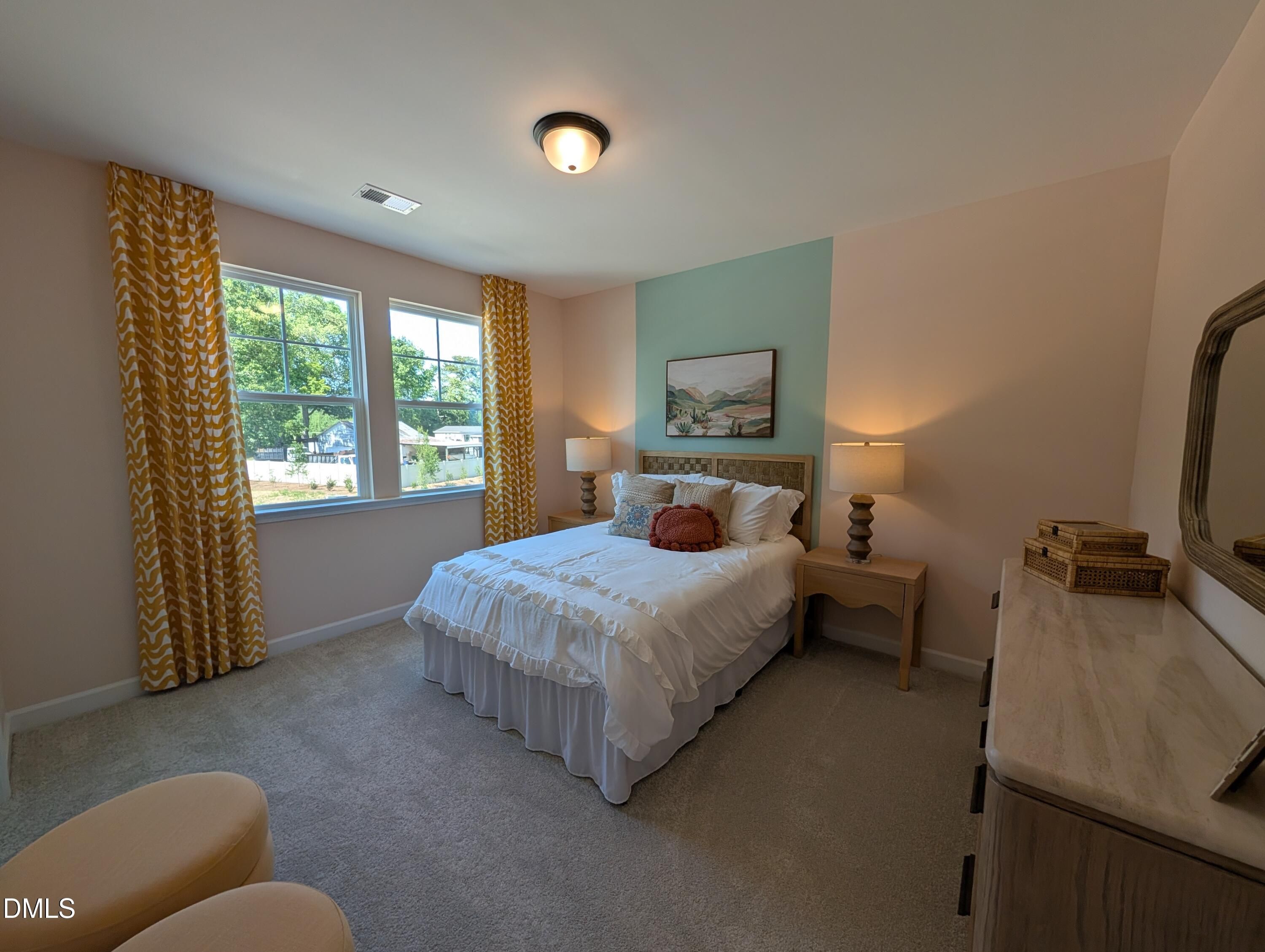 Cozy bedroom with accent wall in The Aspen B floor plan at Wendell Ridge, Wendell, North Carolina.