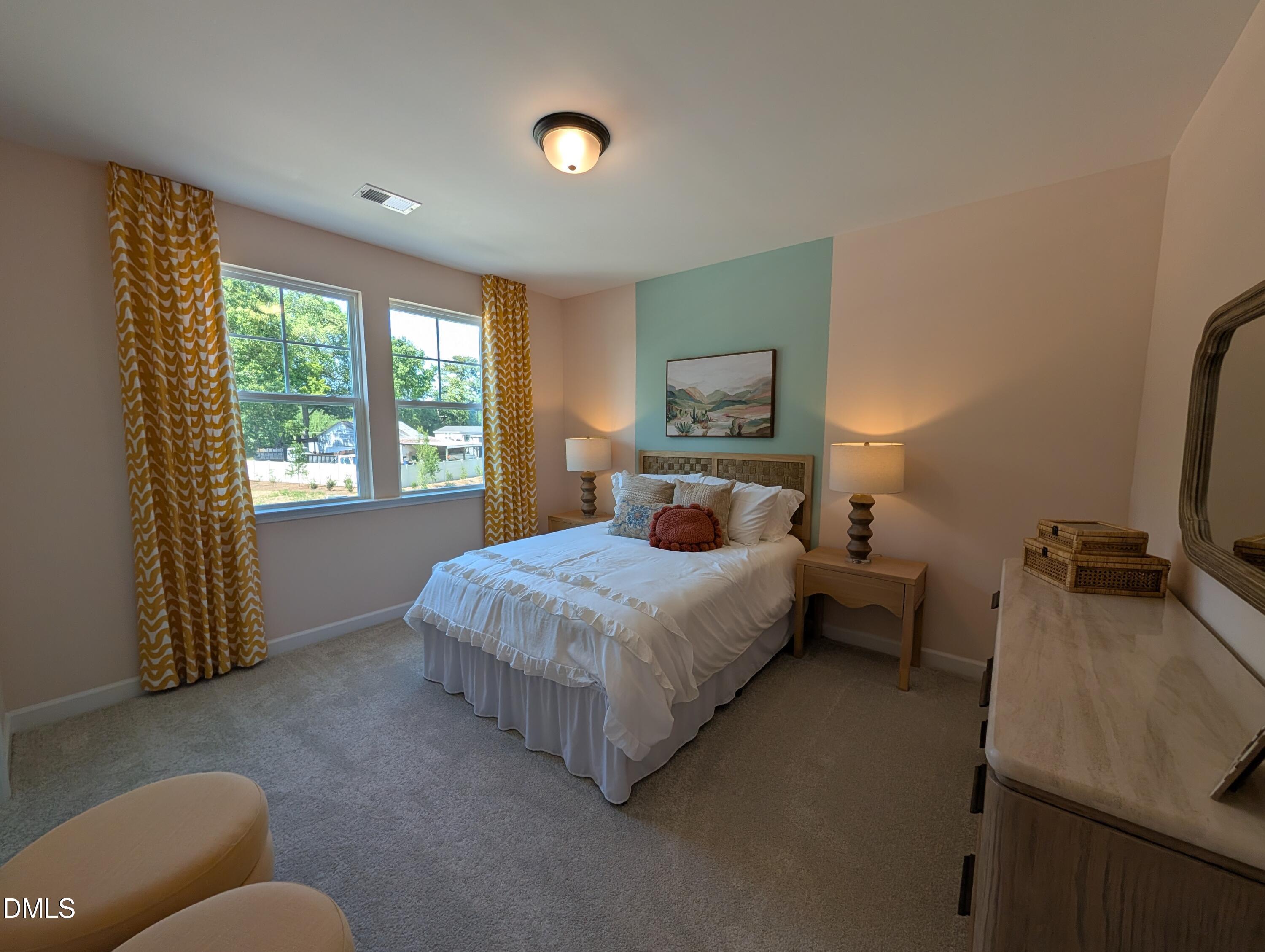 Cozy bedroom with accent wall in The Aspen B floor plan at Wendell Ridge, Wendell, North Carolina.
