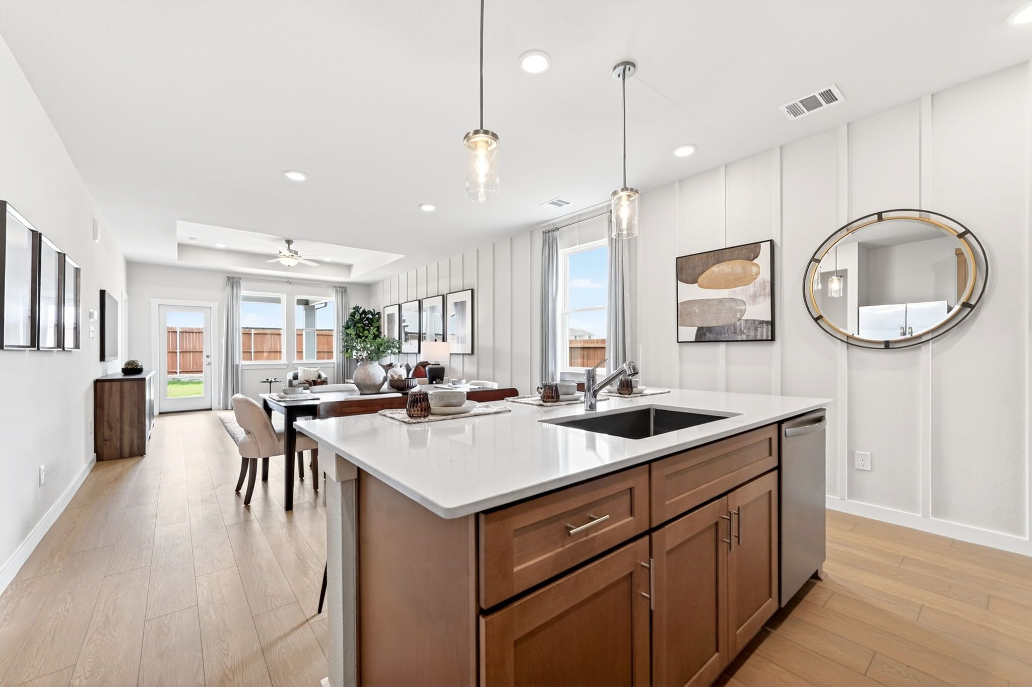Open-concept kitchen and dining area at Mesa Vista in San Antonio with Davidson Homes’ signature modern wood cabinetry.