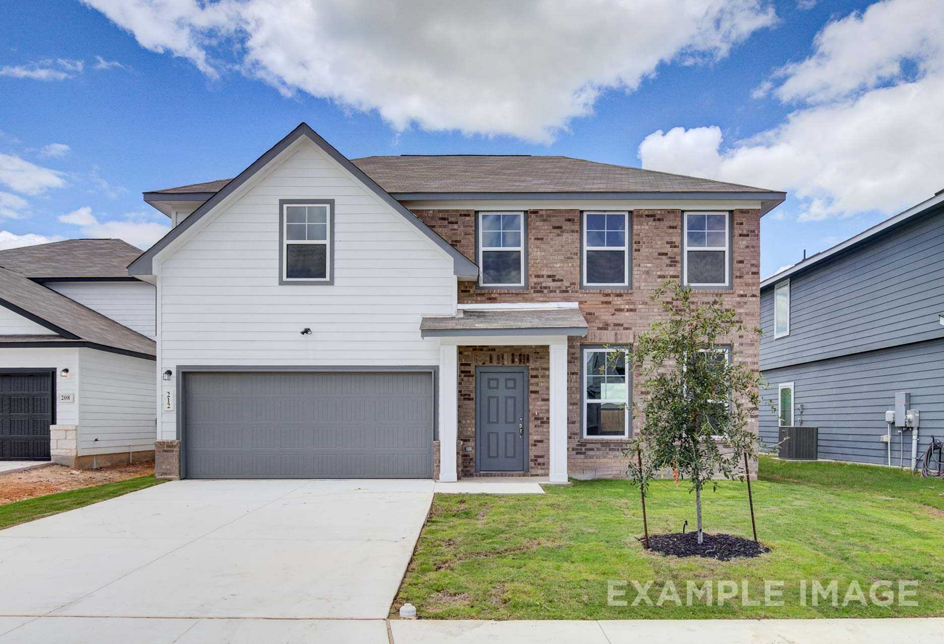 Two-story Murray F home elevation featuring white siding, brick accents, gray 2-car garage, and front lawn in San Antonio