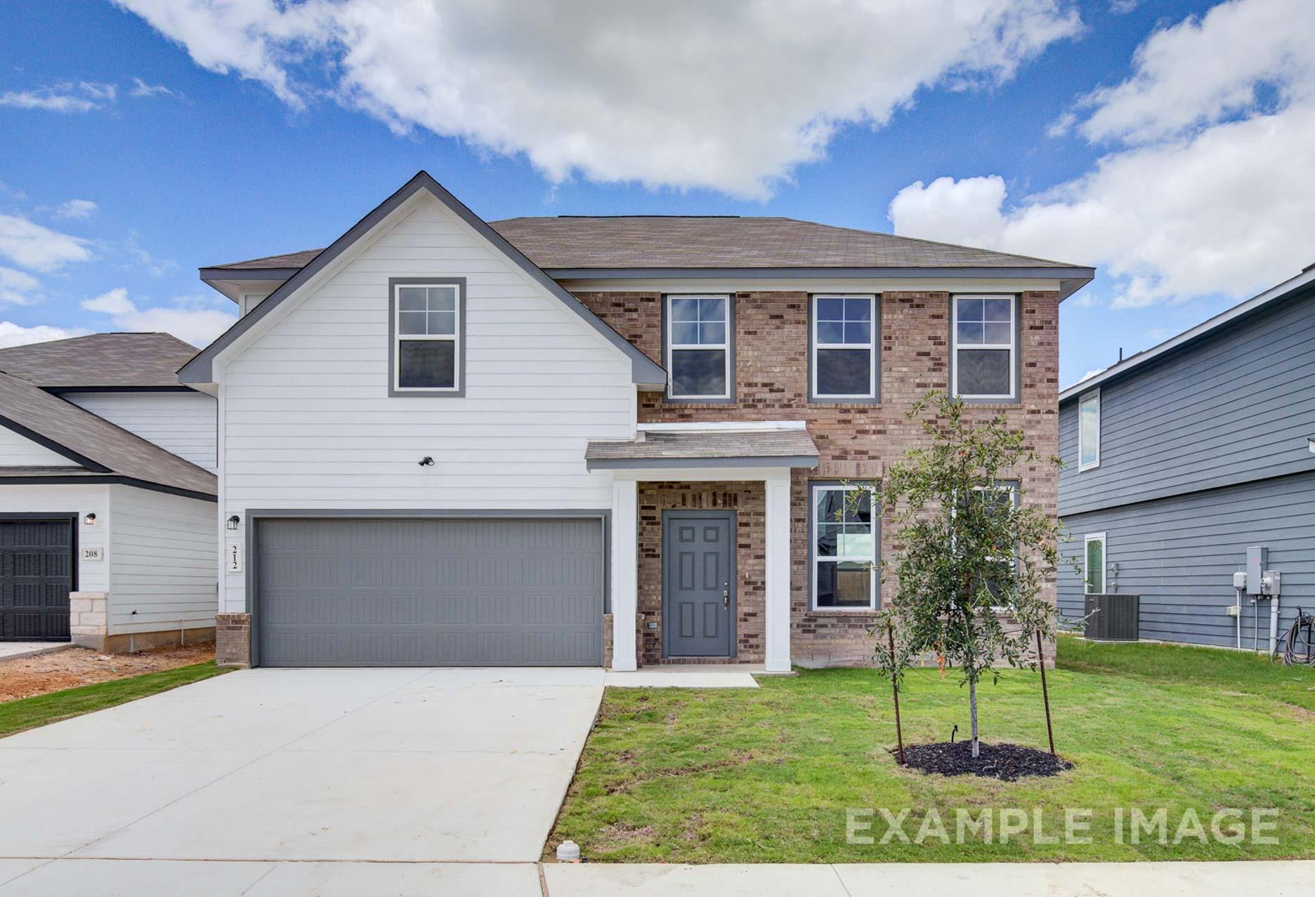 Two-story Murray I home elevation with white siding, brick accents, gray two-car garage, and front porch in San Antonio