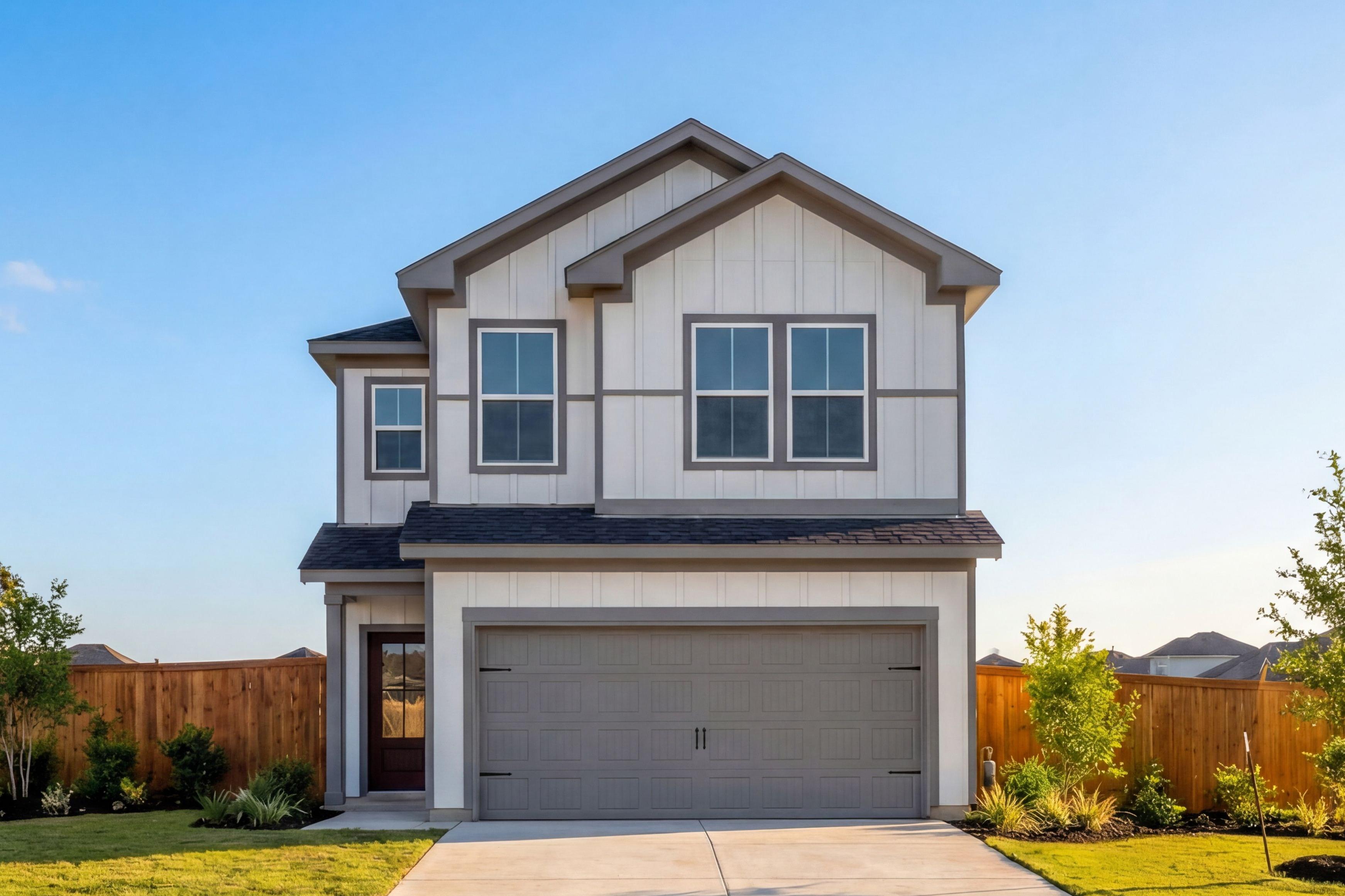 Modern two-story home exterior at Cedar Heights in San Antonio Texas with gray garage and landscaped yard