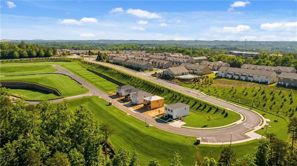 Aerial view of modern 3-bedroom homes in lush green landscapes, The Bluffs community, Canton, Georgia by Davidson Homes