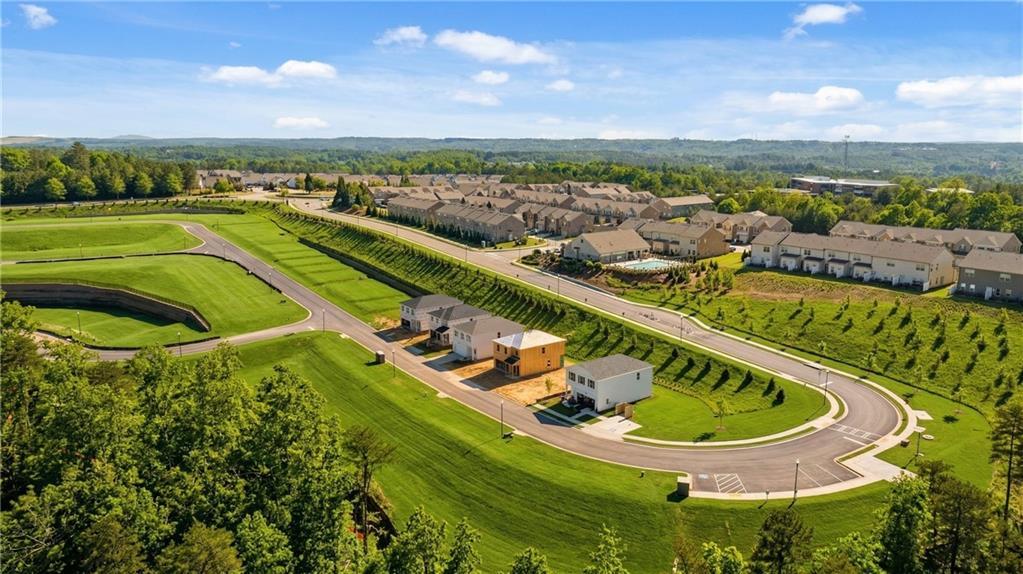 Aerial view of modern 3-bedroom homes in lush green landscapes, The Bluffs community, Canton, Georgia by Davidson Homes