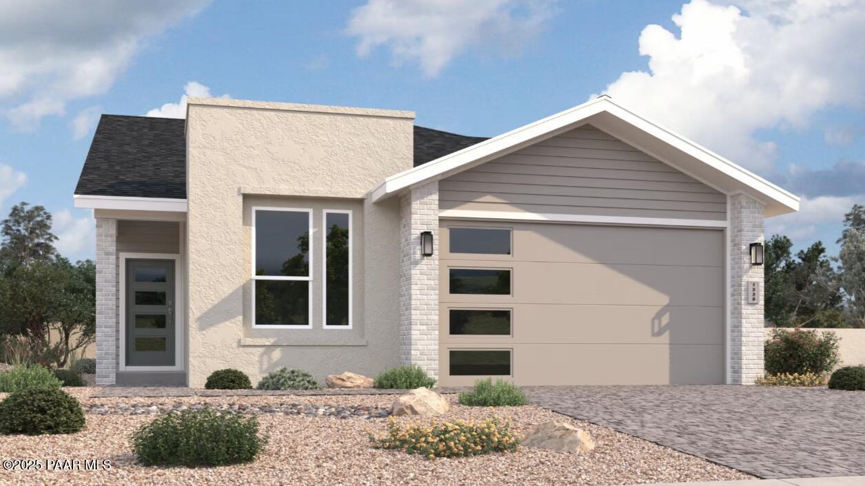 Modern single-story 2-bedroom home exterior with 2-car garage, desert landscaping, The Malibu C by Davidson Homes in Prescott, Arizona