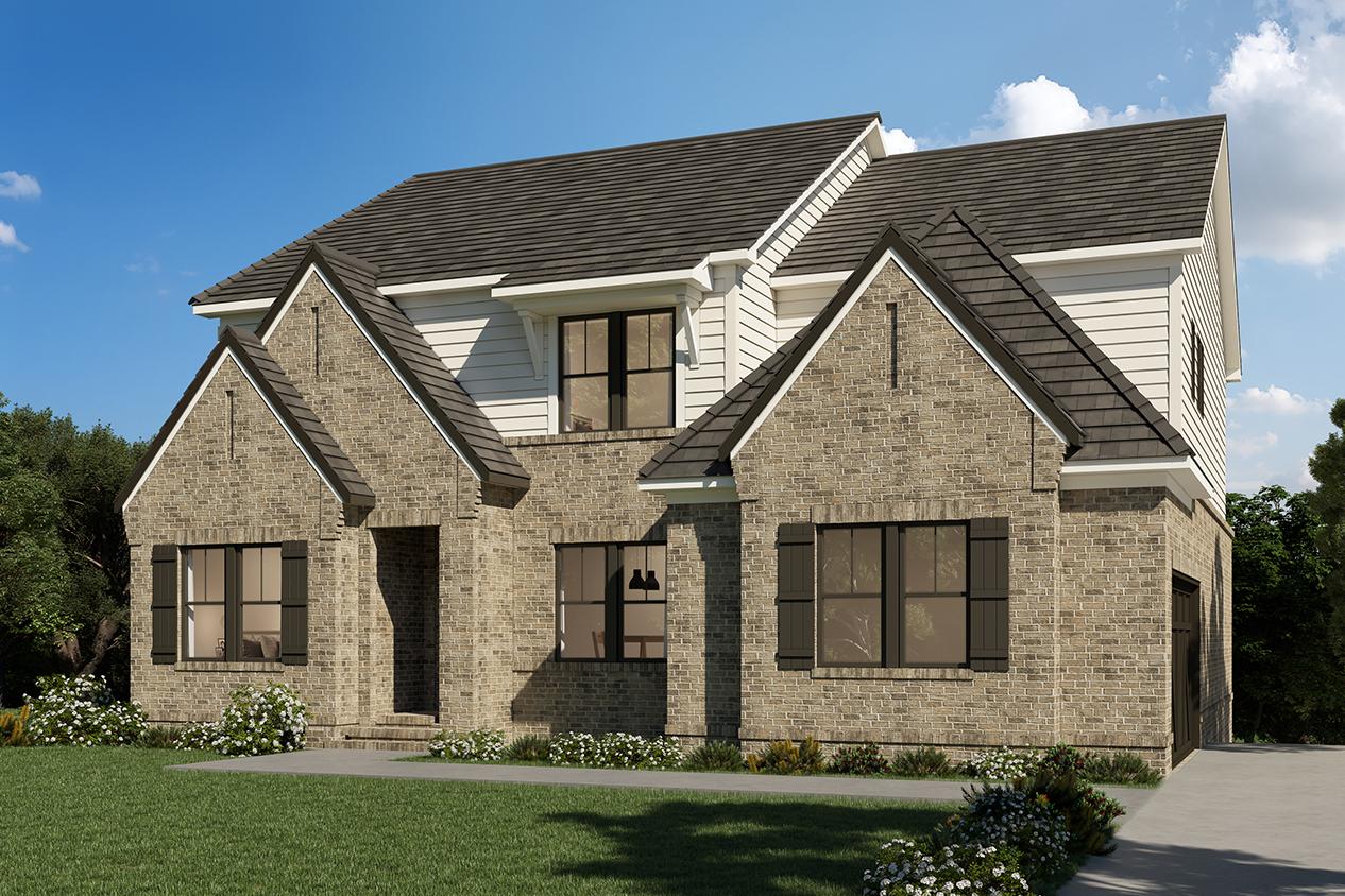 Stunning brick exterior of The Arlington C home design by Davidson Homes, featuring gabled roof, three-car garage, and lush landscaping in East Cobb