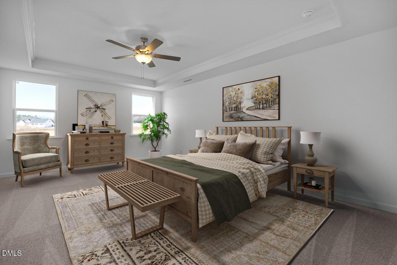 Cozy master bedroom with king bed, wooden furniture, ceiling fan, and artwork in Davidson Homes The Cypress B II, Angier, NC