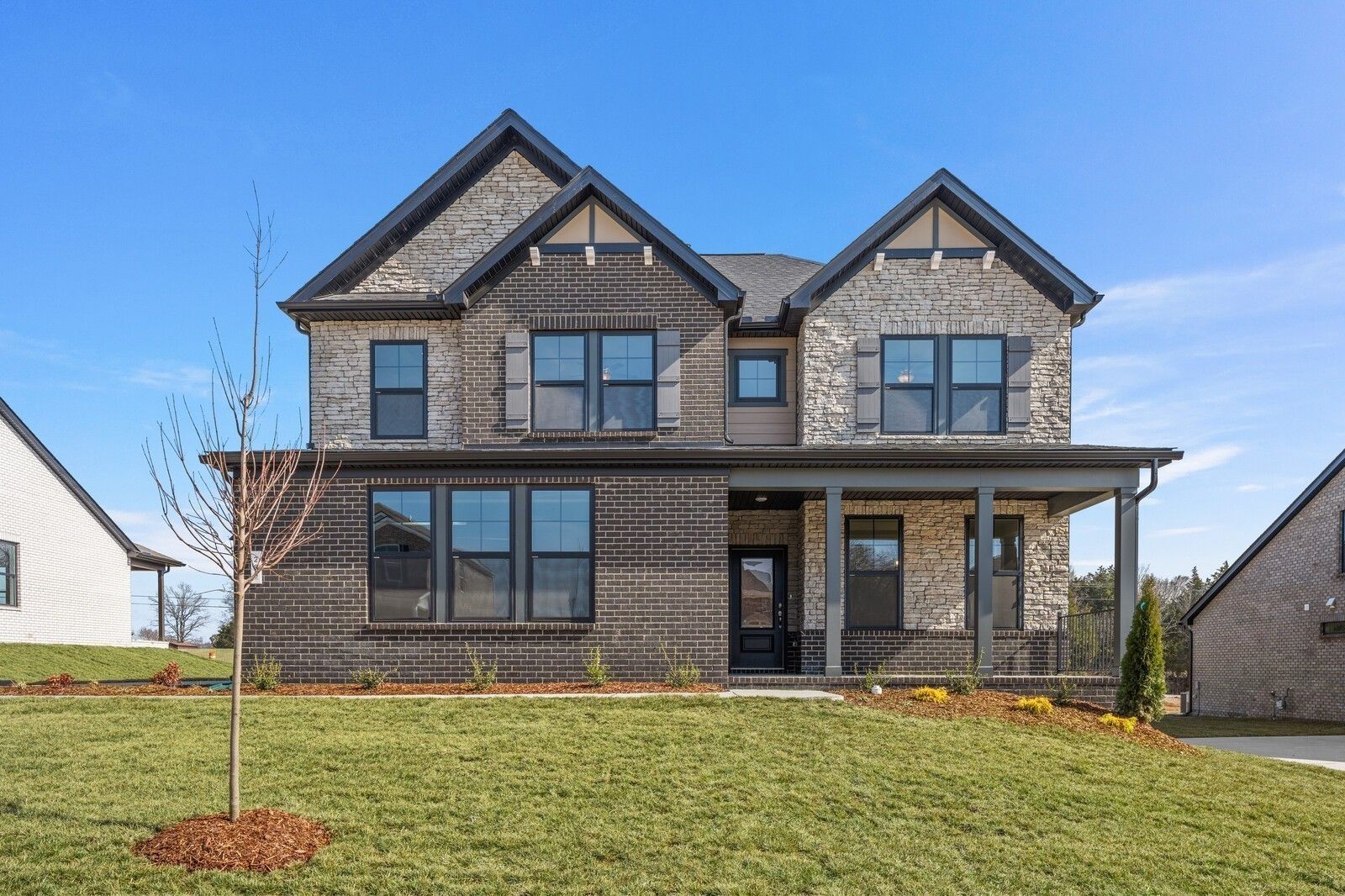 Two-story Willow D floor plan by Davidson Homes with brick and stone exterior in Benders Cove, Mt. Juliet, Tennessee.