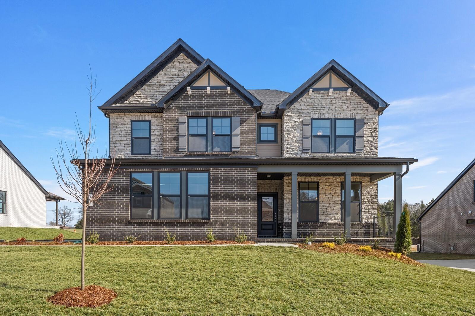 Two-story Willow D floor plan by Davidson Homes with brick and stone exterior in Benders Cove, Mt. Juliet, Tennessee.