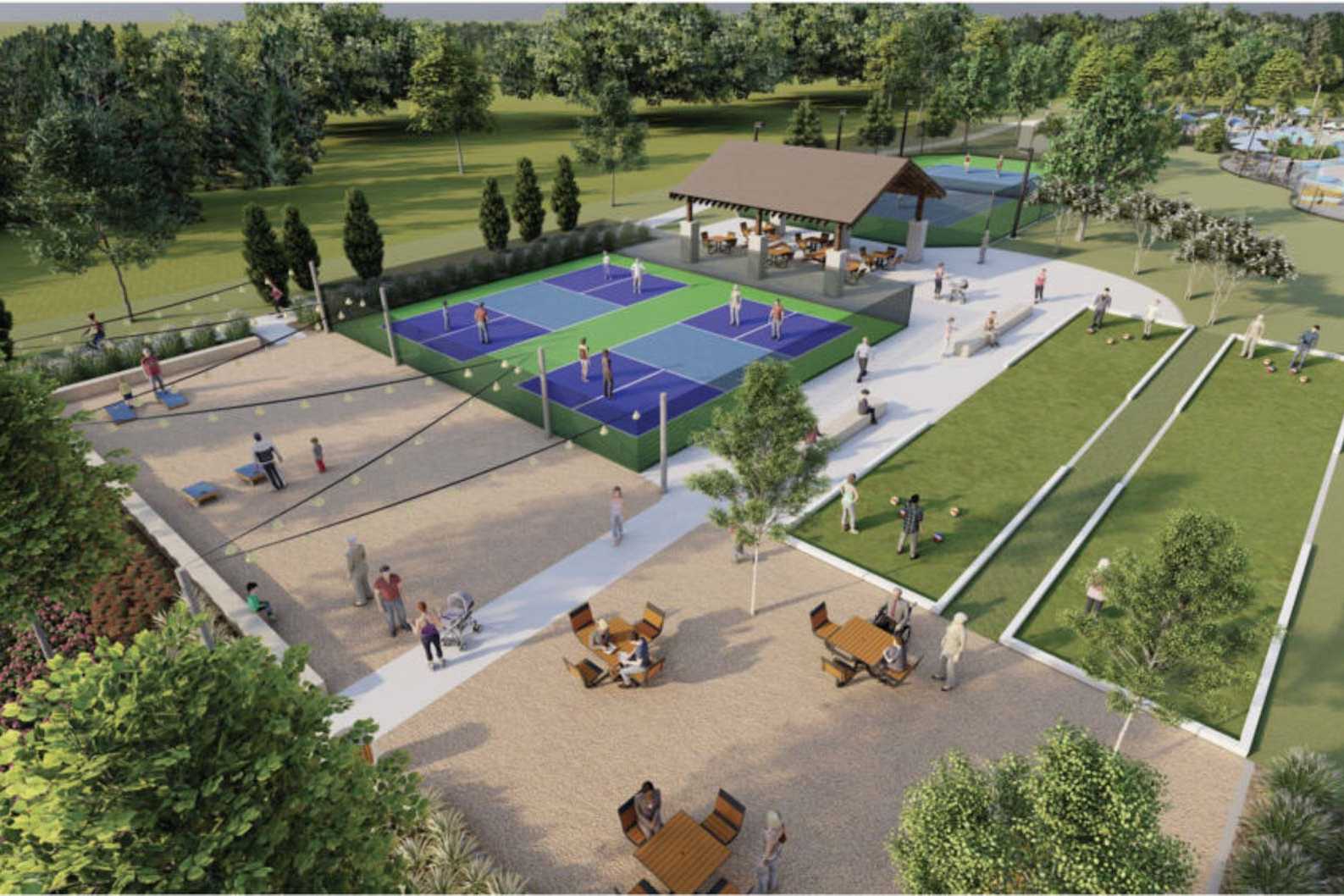 Tennis courts and pavilion at Sierra Vista in Rosharon Texas with blue surfaces seating areas lush trees and paths