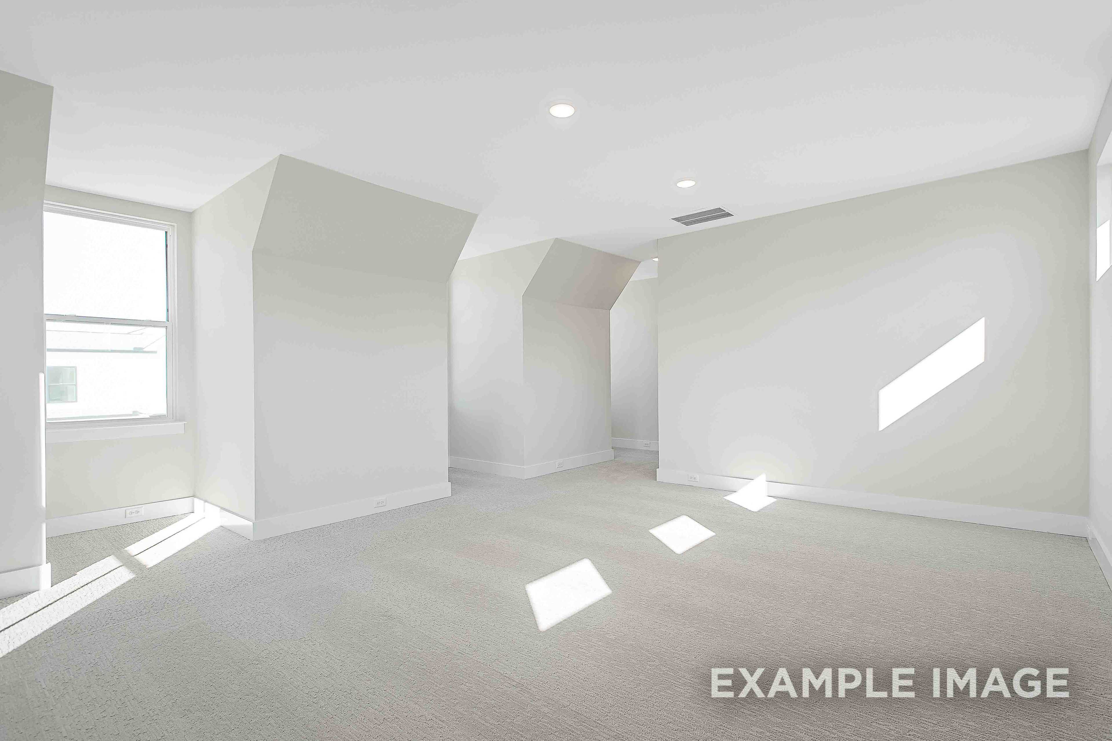 Spacious upper-floor master suite in The Alston A with vaulted ceilings, large windows, and natural light