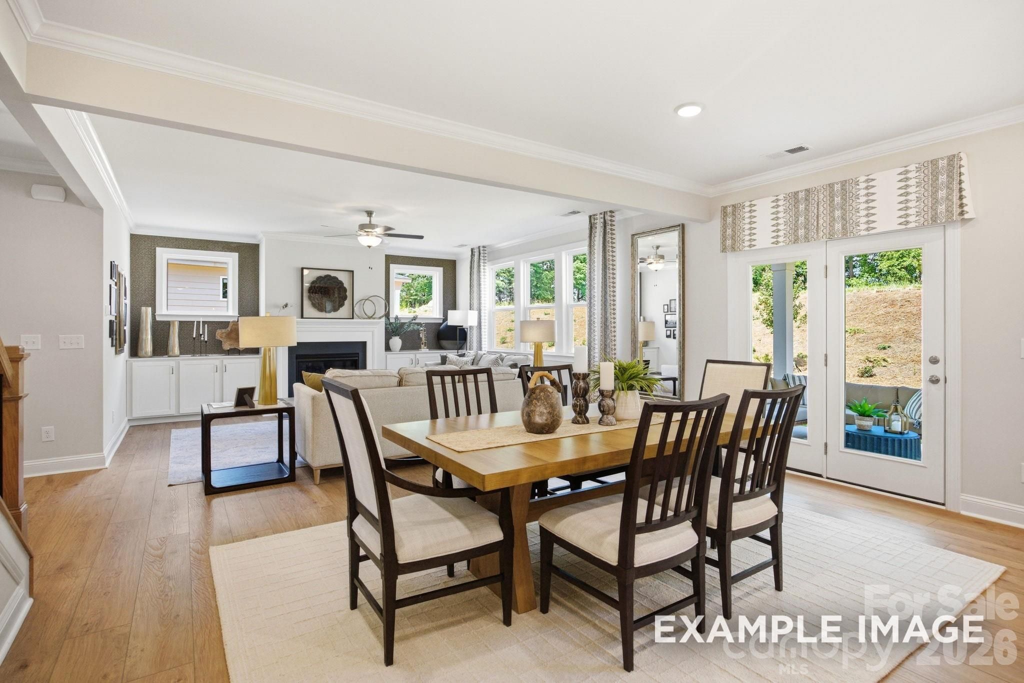 Open-concept dining and living area in The Hickory B II floor plan by Davidson Homes in Windgate, Mooresville, NC.