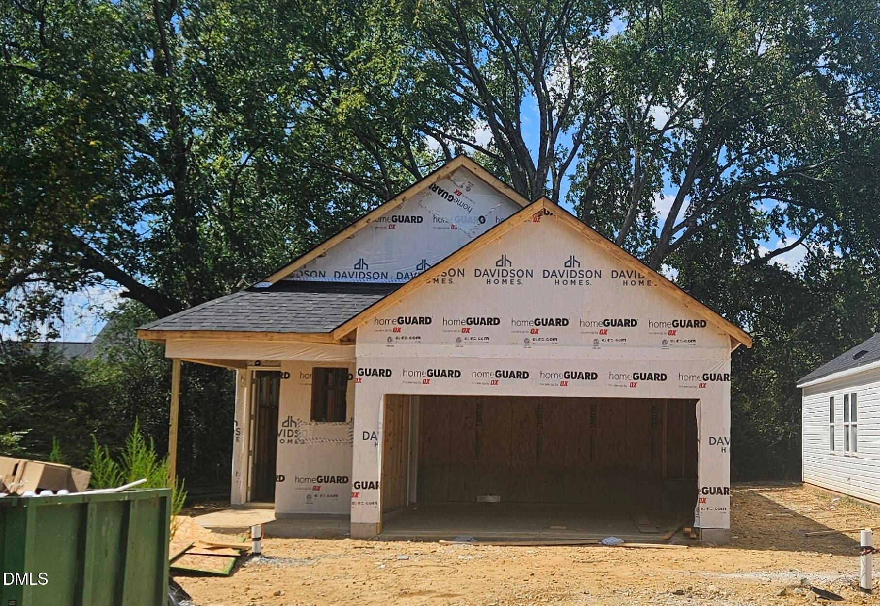New construction single-story home under construction with 2-car garage by Davidson Homes in Gregory Village, Lillington, North Carolina