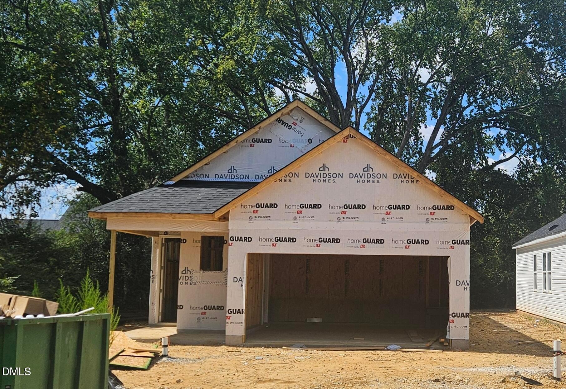 New construction single-story home under construction with 2-car garage by Davidson Homes in Gregory Village, Lillington, North Carolina