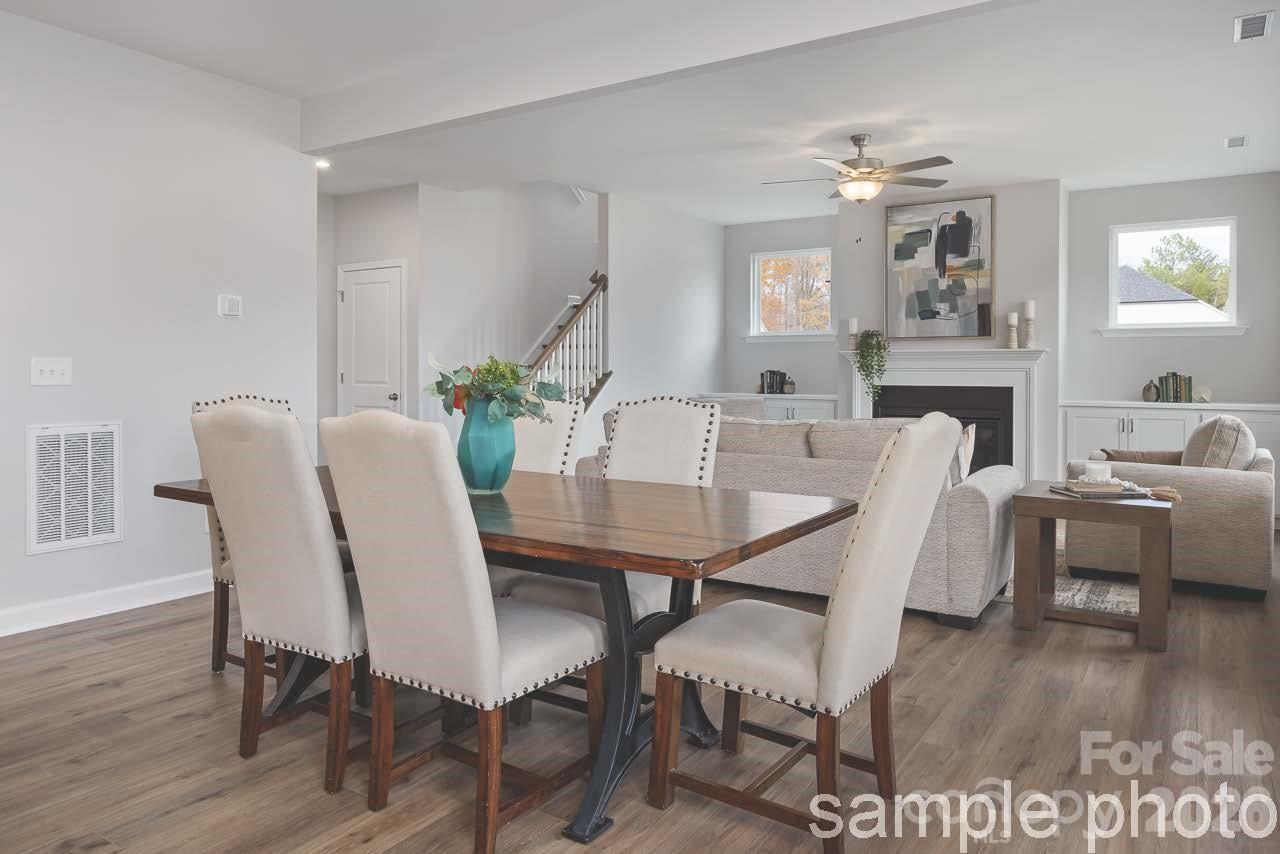 Open-concept dining and living area in The Chestnut D floor plan at Enclave at Belmont, North Carolina by Davidson Homes.