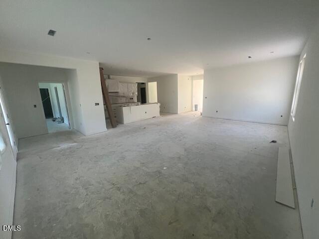 Open-concept great room and kitchen under construction in Davidson Homes Magnolia II B, 4-bedroom new home in Lillington, NC