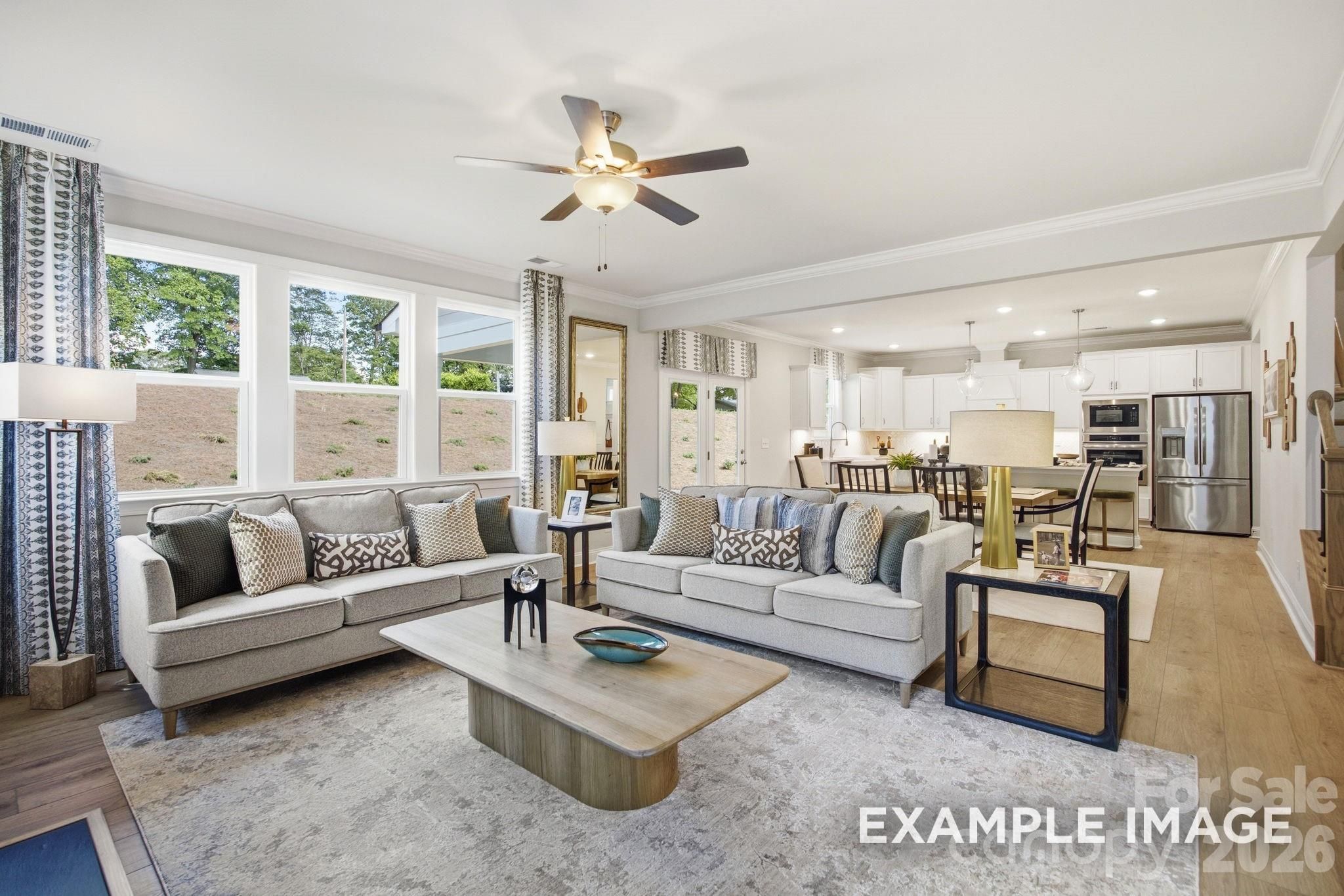 Open-concept living room and kitchen in The Hickory B II floor plan at Windgate in Mooresville, North Carolina.