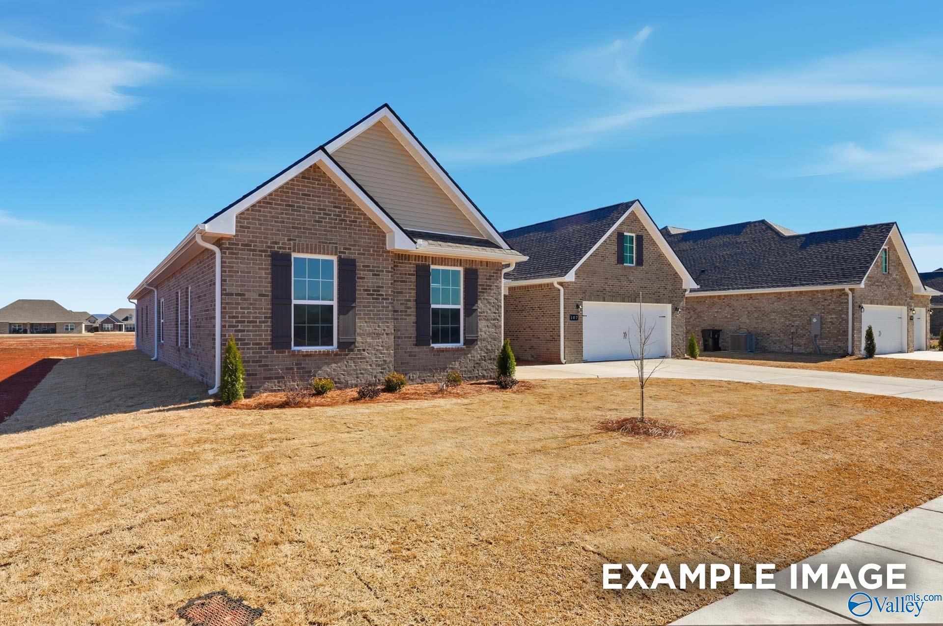 Brick exterior of The Valencia floor plan by Davidson Homes with a 3-car garage in Briercreek, Meridianville, Alabama.