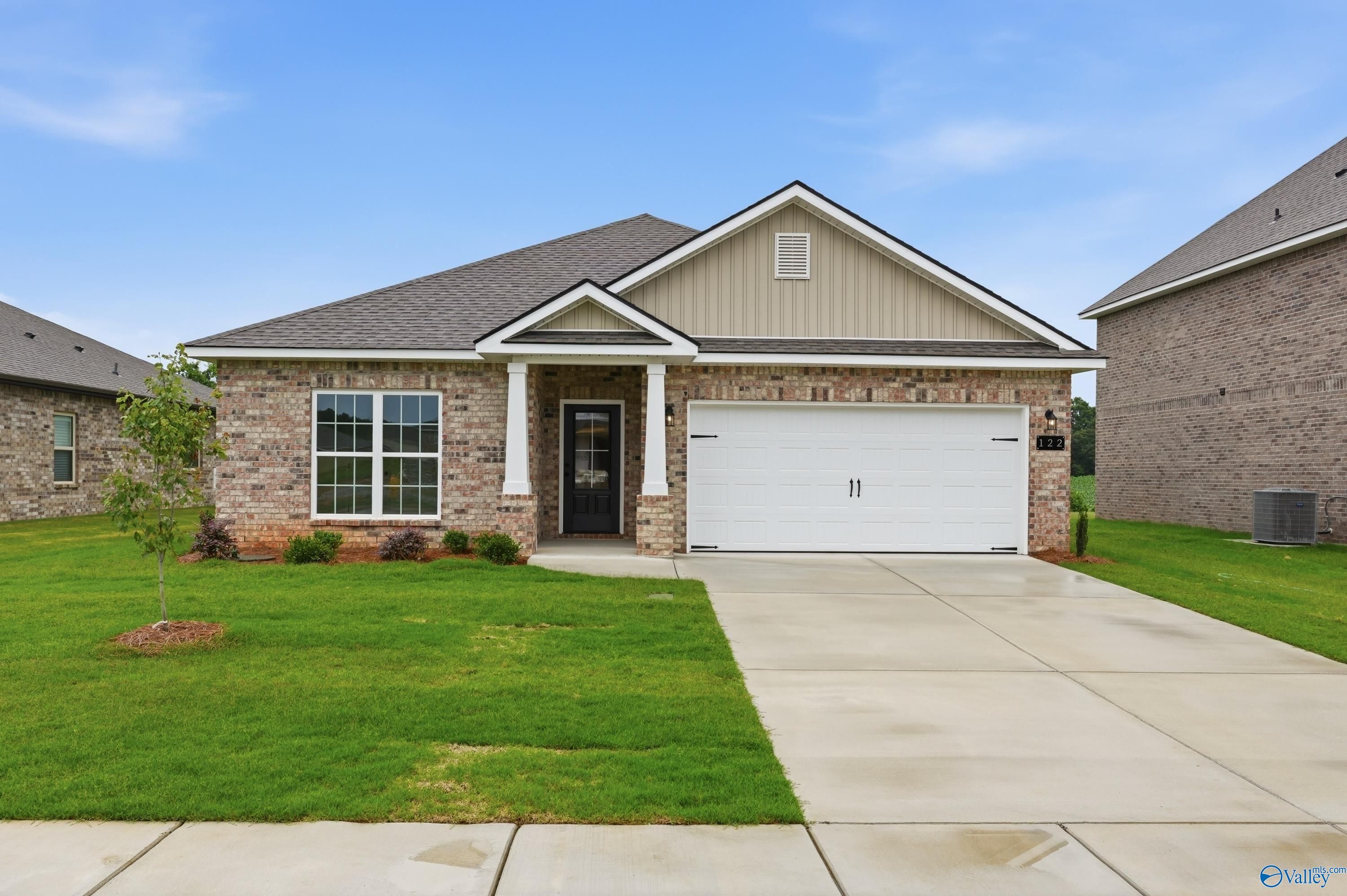 Single-story, 4-bedroom Daphne C floor plan home by Davidson Homes with a 2-car garage in Ivy Hills, Toney, Alabama.
