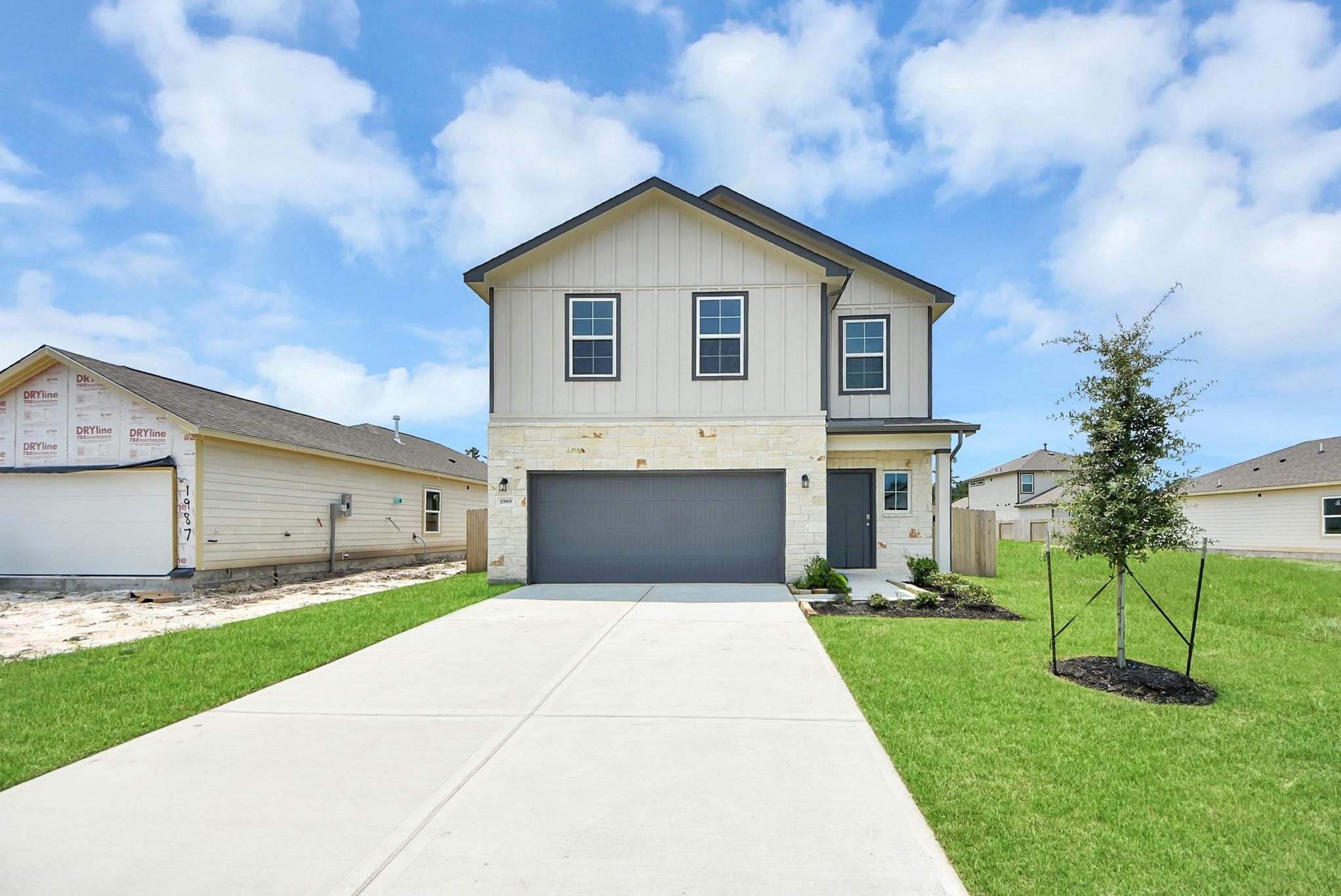 Two-story Blanco E floor plan by Davidson Homes with a 2-car garage in The Villages at WestPointe, Dayton, Texas.