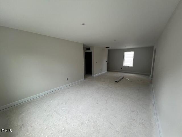 Spacious empty bedroom with neutral walls, carpet floor, large window in Davidson Homes The Preston A, Gregory Village, Lillington, NC