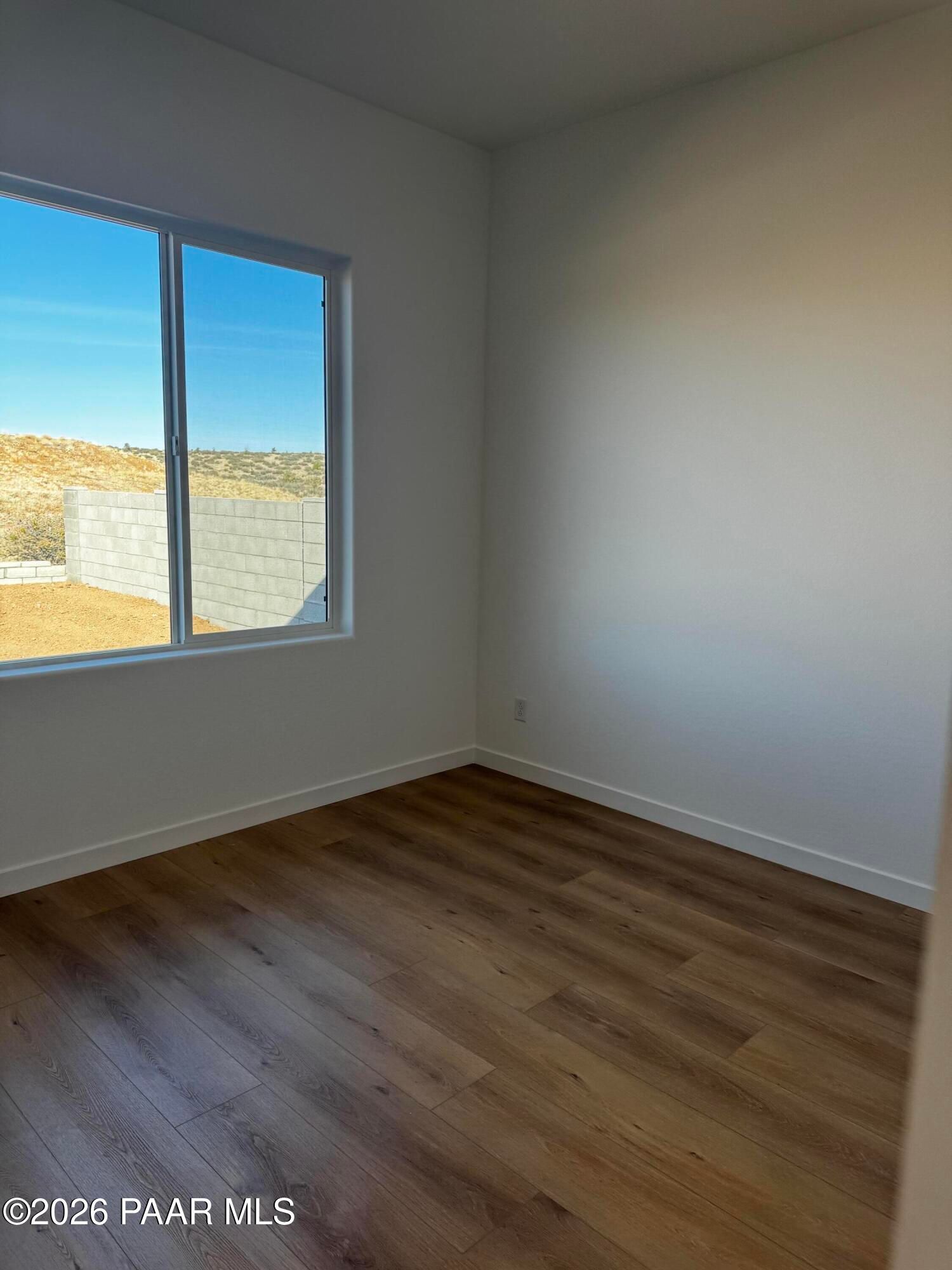 Bright bedroom with large windows and desert view in Davidson Homes The Blaze C, Hidden Hills, Prescott, Arizona