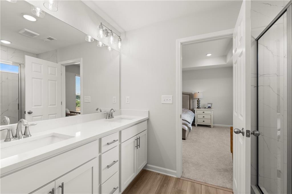 Modern master bathroom with dual sink vanity in The Wake B floor plan by Davidson Homes in Hemingway, Cumming, Georgia.