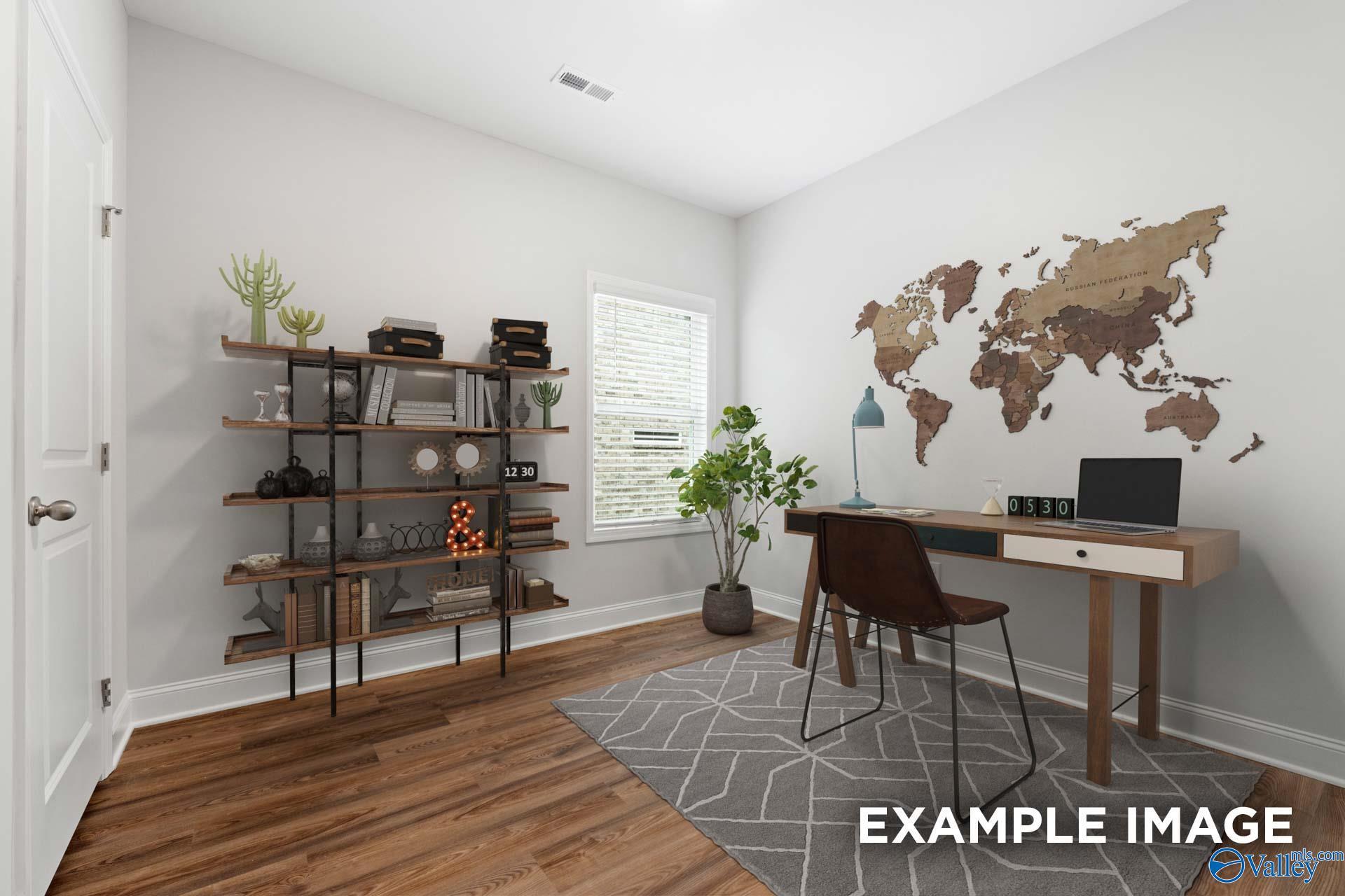 Cozy home office with wooden desk, bookshelf, potted plants, and world map wall in Davidson Homes The Cumberland, Decatur, Alabama