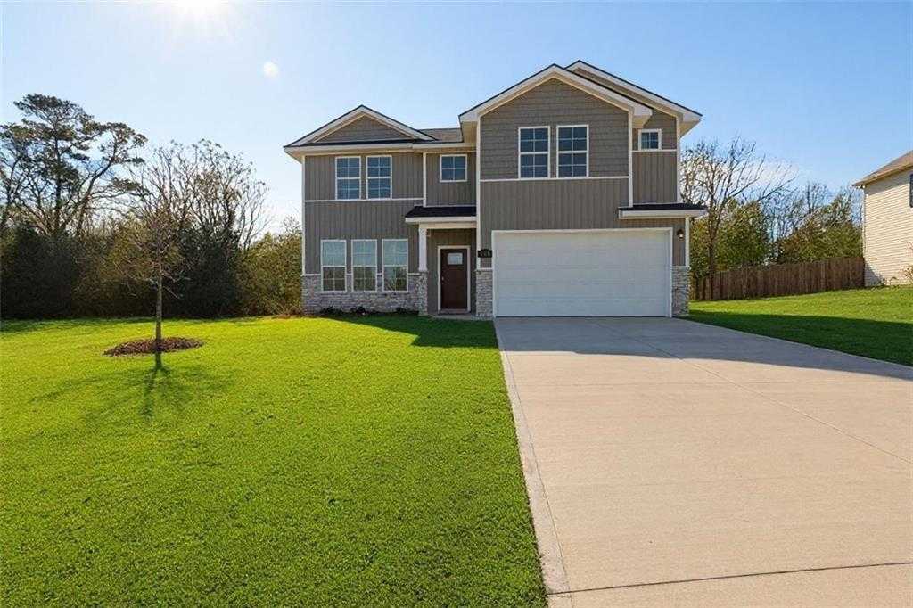 Two-story gray home with 2-car garage, driveway, and lush green lawn in Ivy Glen, Perry, Georgia - Evermore Homes The Stella