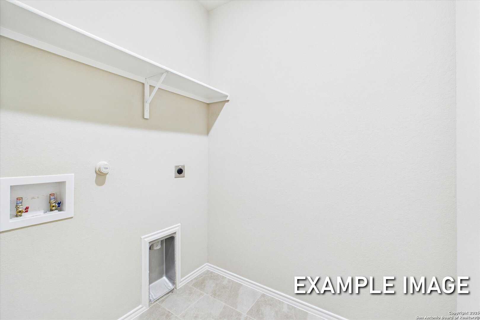 Bright laundry room with white shelves, washer/dryer hookups, utility sink in Davidson Homes The Comal B, San Antonio