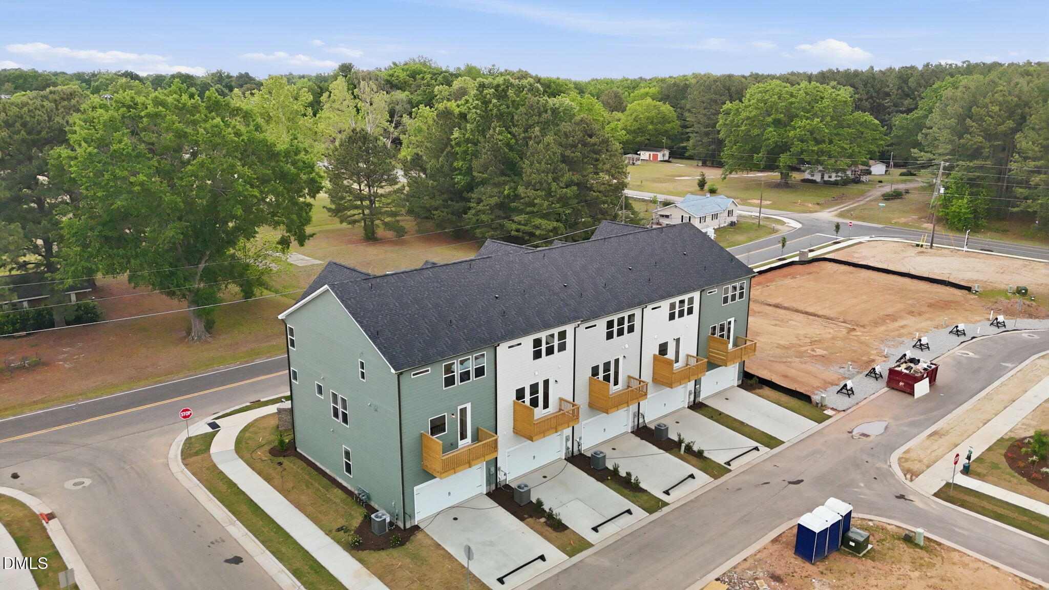 Aerial view of 3-story Davidson Homes townhomes with 2-car garages at Camden Park in Knightdale, North Carolina.