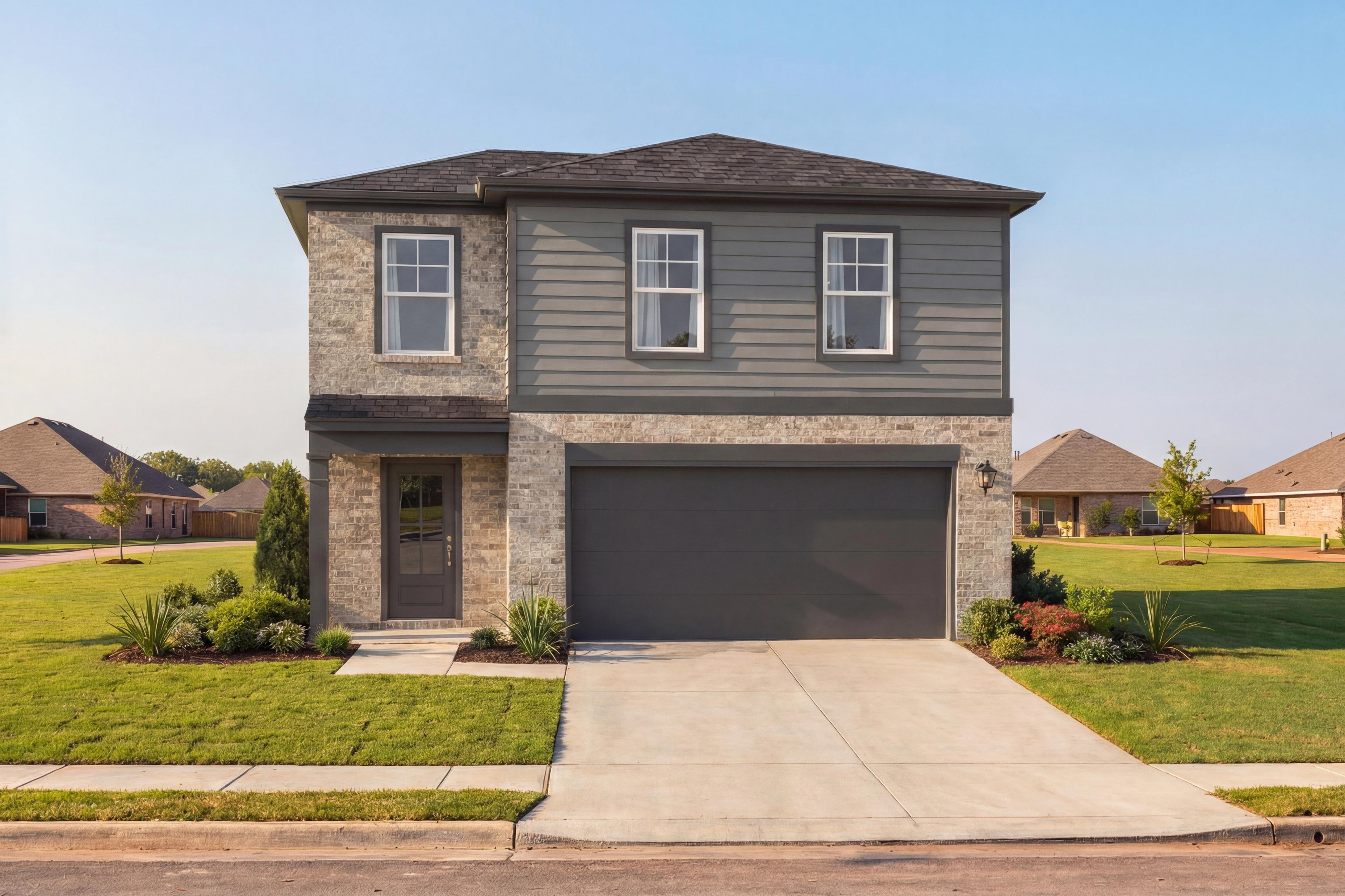 Two-story Blanco F home exterior by Davidson Homes in Magnolia Texas, gray siding, brick accents, two-car garage, landscaped yard