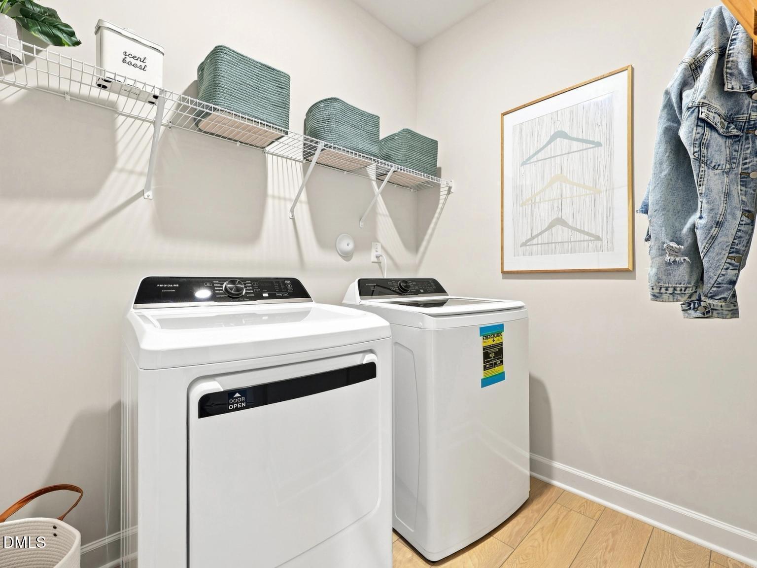 Laundry room with white washer and dryer in The Daphne C floor plan by Davidson Homes at Woodland Crossing in Zebulon, NC.