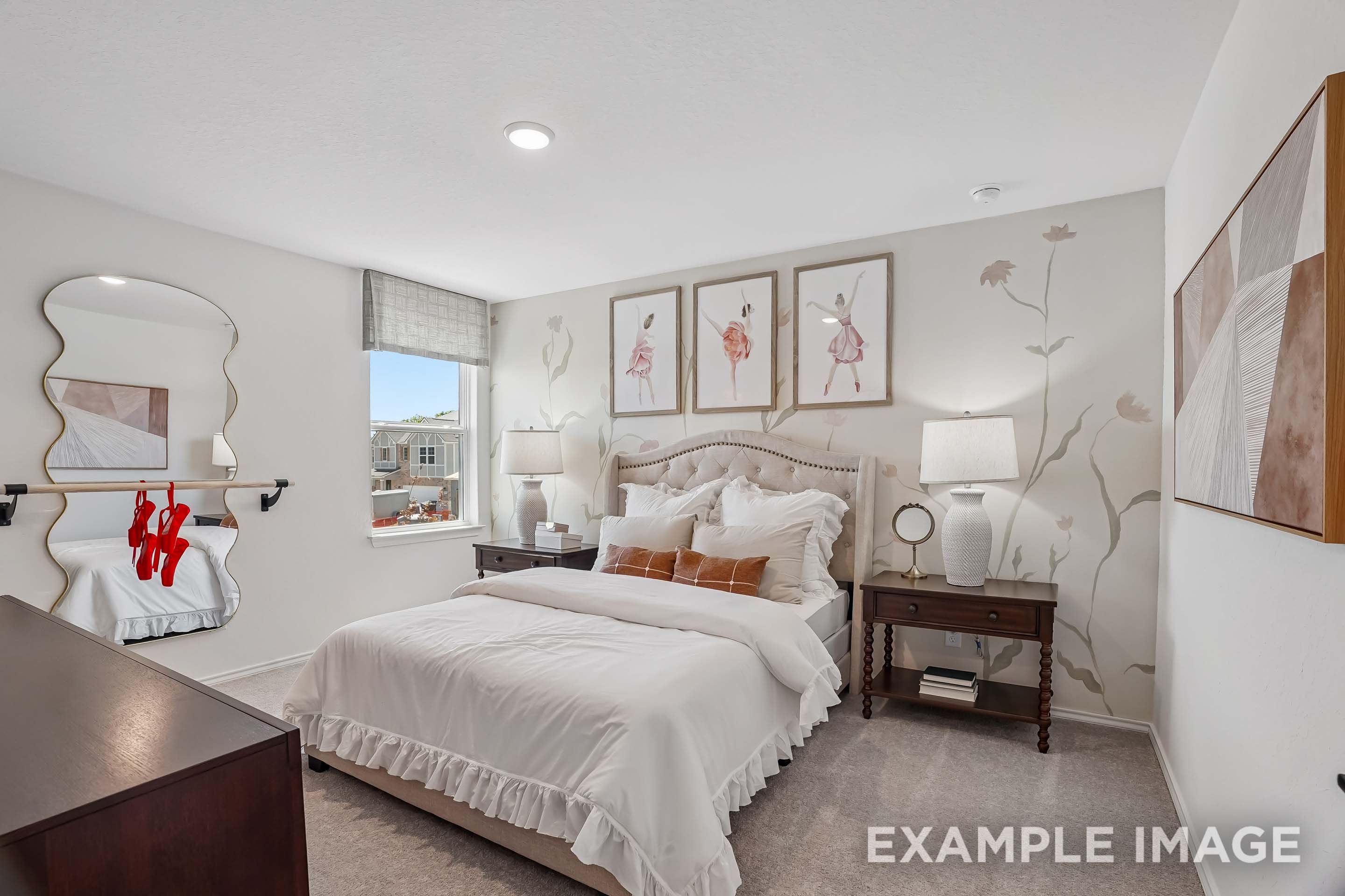 Cozy master bedroom in The Pinecrest D design featuring floral wall art, ballet decor, and elegant neutral furnishings.