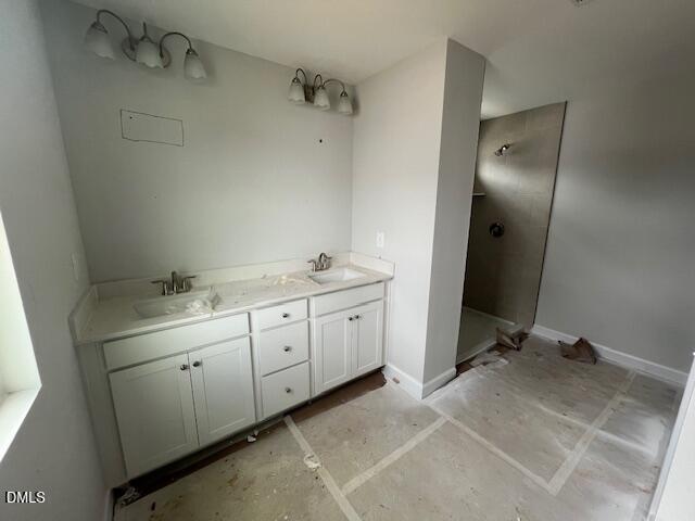 Modern master bathroom with double vanity, white cabinets, and glass walk-in shower in Davidson Homes Adalynn B, Lillington NC