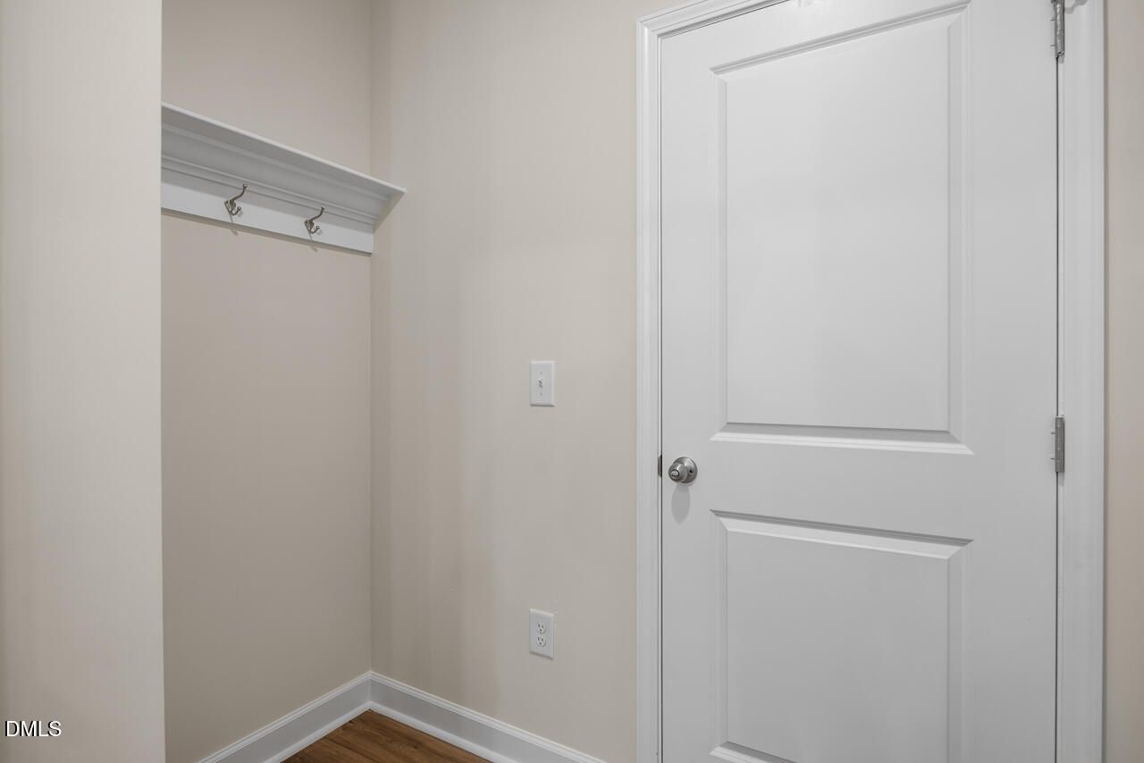 Mudroom area with wall-mounted coat hooks in The Hickory II B floor plan at Montrose in Aberdeen, North Carolina.