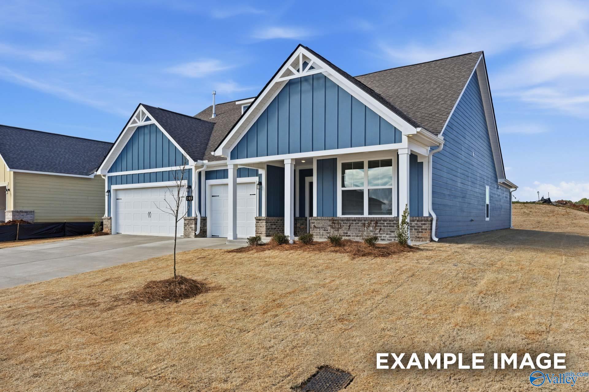 Blue craftsman home with gabled roof, 2-car garage, and front porch in Evergreen Mill, Madison, AL by Davidson Homes