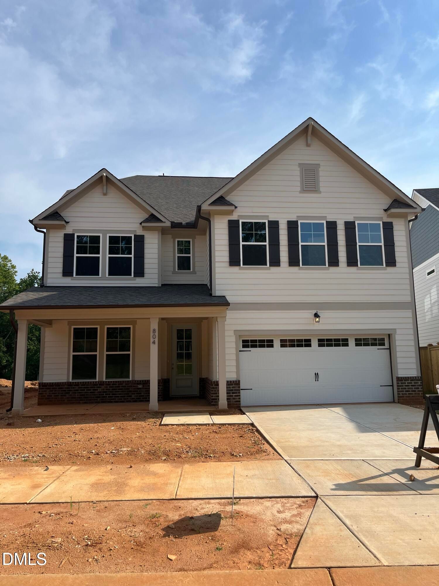 The Aspen floor plan by Davidson Homes in Sage on North Main, Wake Forest, NC featuring a 2-car garage and front porch.