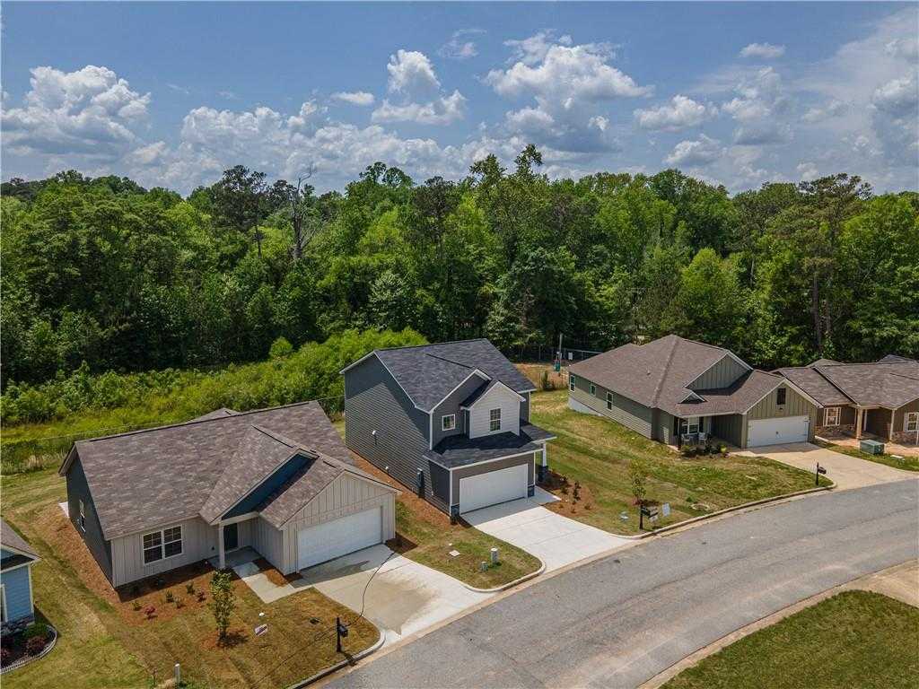 Aerial view of modern 3-bedroom Davidson Homes with 2-car garages in wooded Summer Vineyard, Phenix City, Alabama