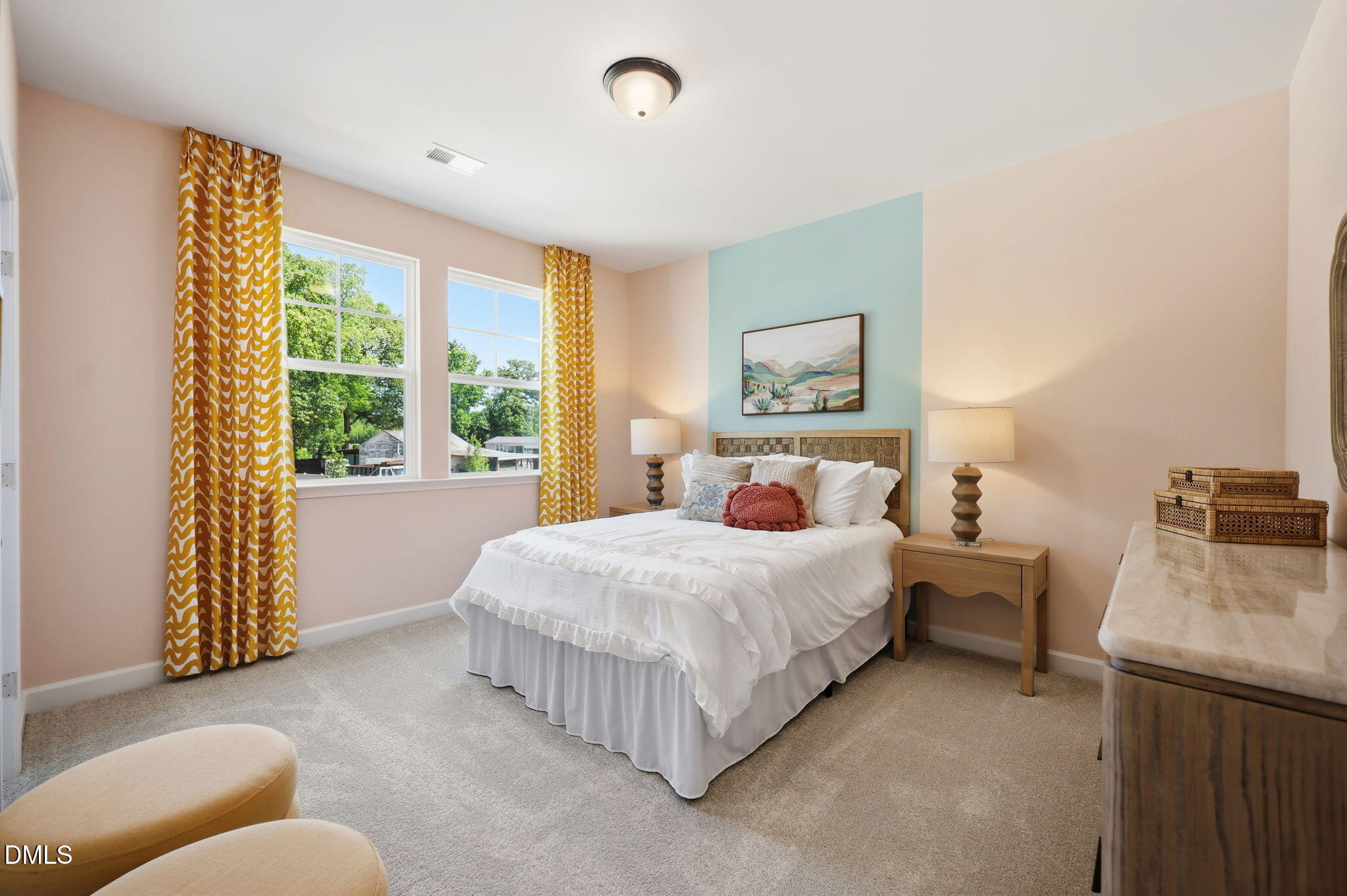 Bright secondary bedroom with colorful accent wall in The Aspen B floor plan at Wendell Ridge, Wendell, North Carolina.