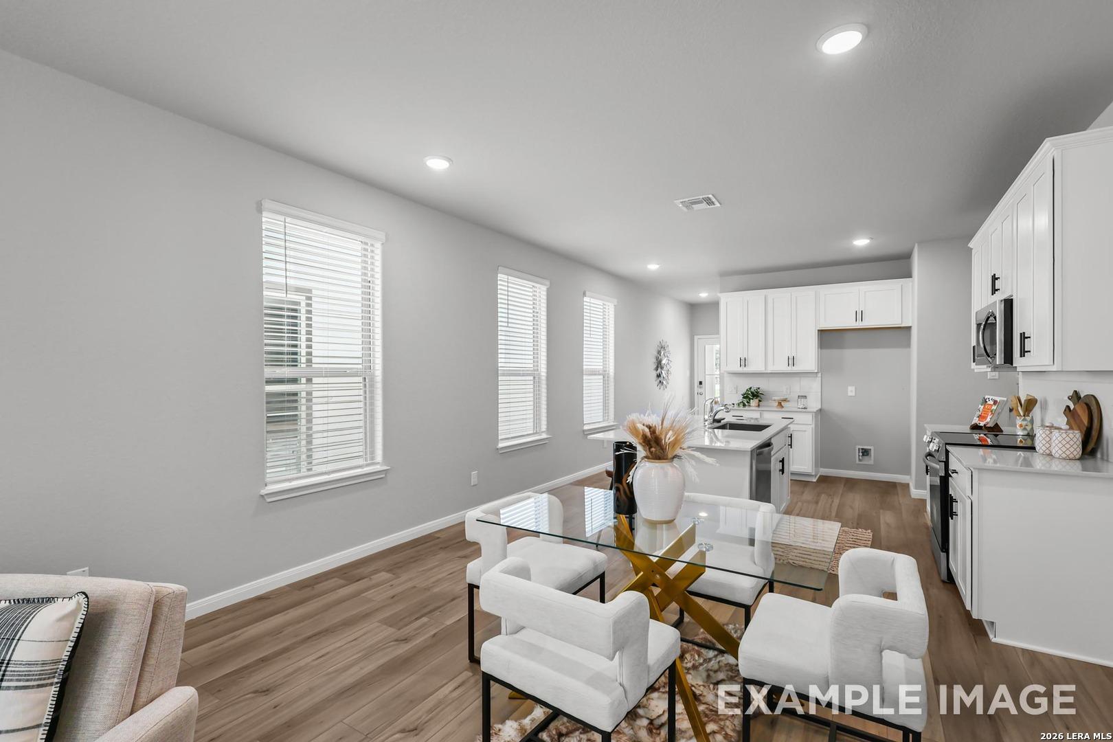 Bright open-concept dining area and kitchen in The Gillian A floor plan by Davidson Homes in Cedar Heights, San Antonio.