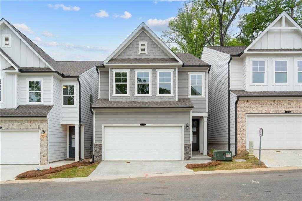 Modern gray two-story home with 2-car garage, Davidson Homes Marion B plan in The Village at Shallowford, Kennesaw, Georgia