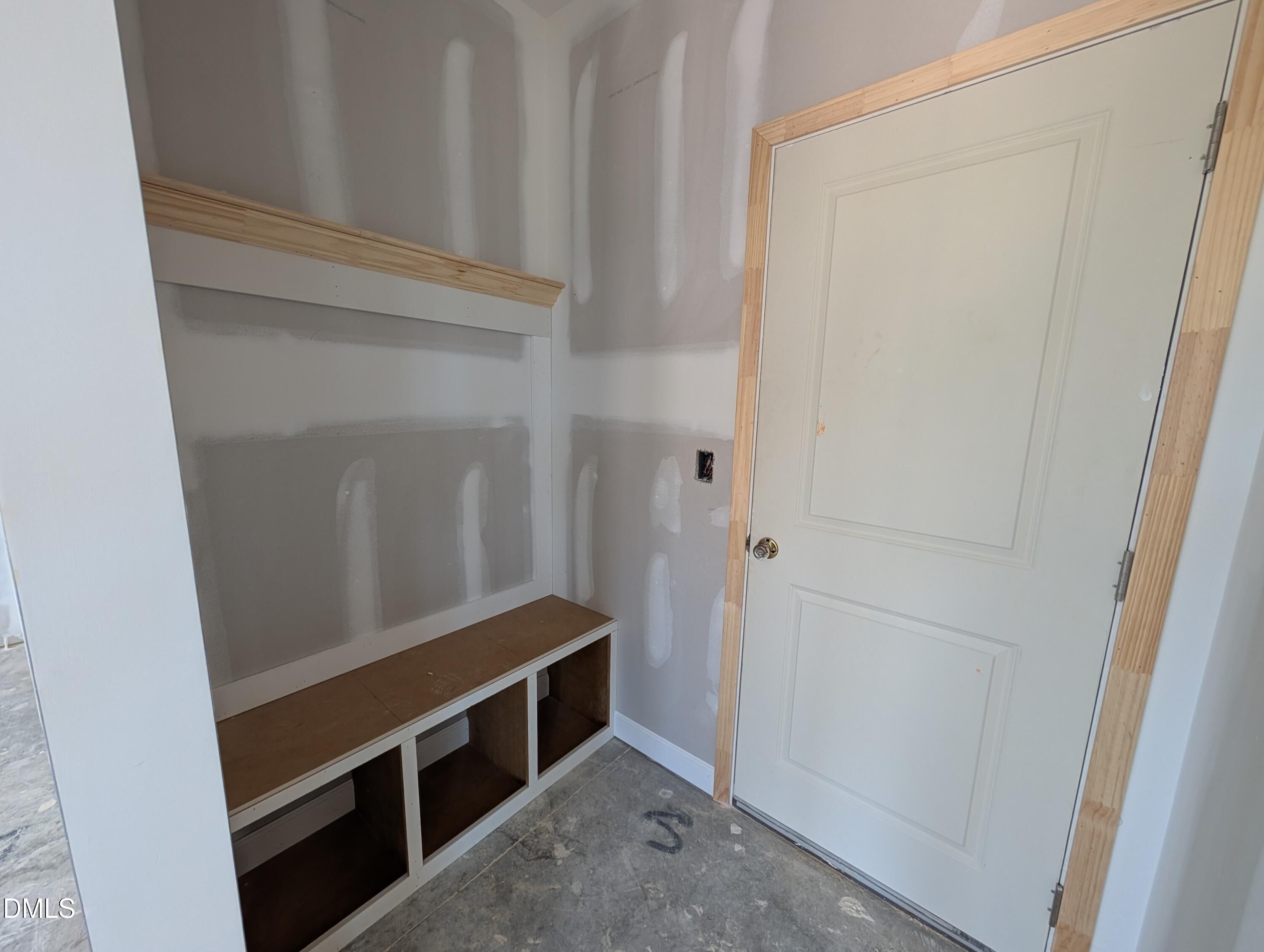 Mudroom drop zone with built-in bench and cubbies in The Chestnut floor plan at Wendell Ridge, Wendell, North Carolina.